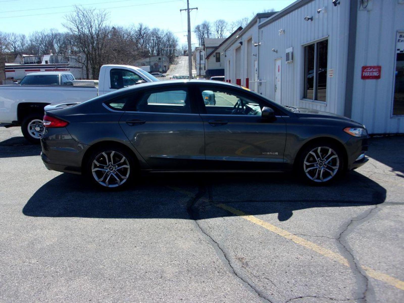 2017 GRAY FORD FUSION SE HYBRID (3FA6P0LU3HR) with an 2.0L engine, Continuously Variable transmission, located at 501 E. Columbia St., Springfield, OH, 45503, (800) 262-7122, 39.925262, -83.801796 - ***Hybrid***SE***New Tires***Back-up Camera***SHARP*** Jay North Auto has offered hand picked vehicles since 1965! Our customer's enjoy a NO pressure buying experience with a small town feel. All of our vehicles get fully inspected and detailed. We are a preferred dealer for many local credit un - Photo #0