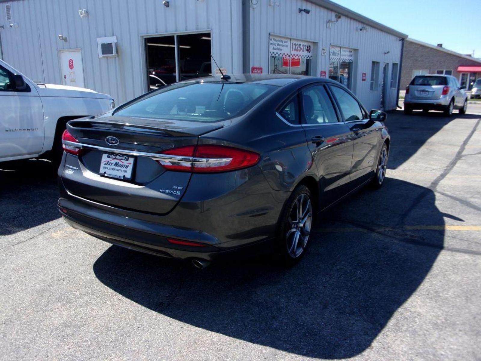 2017 GRAY FORD FUSION SE HYBRID (3FA6P0LU3HR) with an 2.0L engine, Continuously Variable transmission, located at 501 E. Columbia St., Springfield, OH, 45503, (800) 262-7122, 39.925262, -83.801796 - ***Hybrid***SE***New Tires***Back-up Camera***SHARP*** Jay North Auto has offered hand picked vehicles since 1965! Our customer's enjoy a NO pressure buying experience with a small town feel. All of our vehicles get fully inspected and detailed. We are a preferred dealer for many local credit un - Photo #3