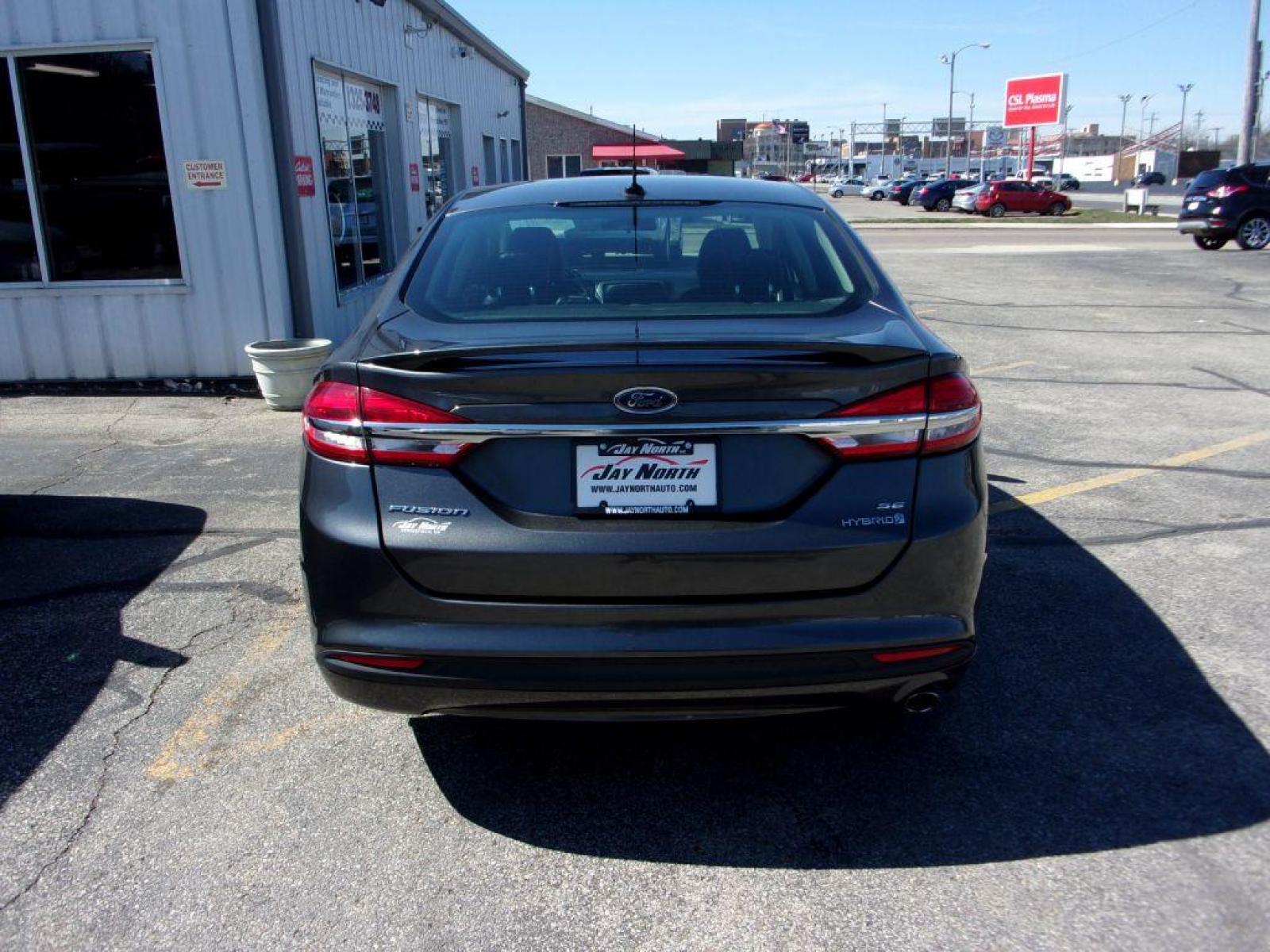 2017 GRAY FORD FUSION SE HYBRID (3FA6P0LU3HR) with an 2.0L engine, Continuously Variable transmission, located at 501 E. Columbia St., Springfield, OH, 45503, (800) 262-7122, 39.925262, -83.801796 - ***Hybrid***SE***New Tires***Back-up Camera***SHARP*** Jay North Auto has offered hand picked vehicles since 1965! Our customer's enjoy a NO pressure buying experience with a small town feel. All of our vehicles get fully inspected and detailed. We are a preferred dealer for many local credit un - Photo #4