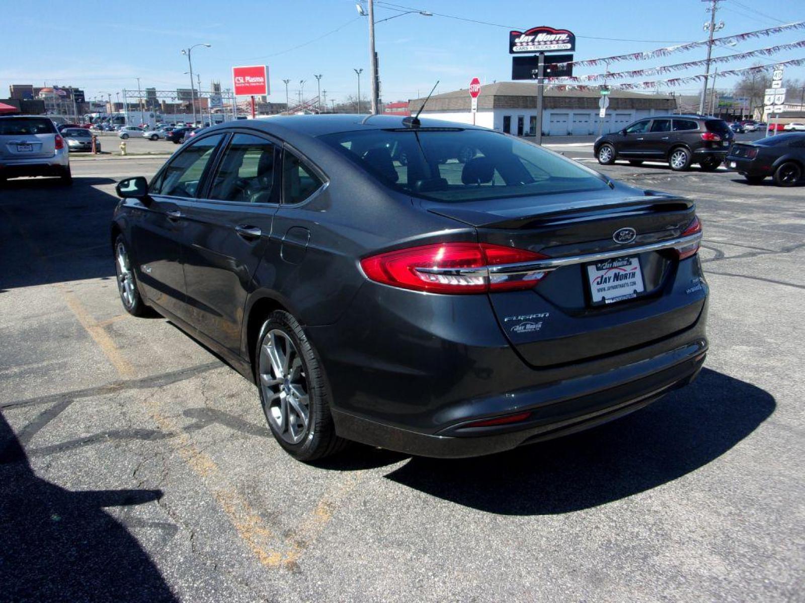2017 GRAY FORD FUSION SE HYBRID (3FA6P0LU3HR) with an 2.0L engine, Continuously Variable transmission, located at 501 E. Columbia St., Springfield, OH, 45503, (800) 262-7122, 39.925262, -83.801796 - ***Hybrid***SE***New Tires***Back-up Camera***SHARP*** Jay North Auto has offered hand picked vehicles since 1965! Our customer's enjoy a NO pressure buying experience with a small town feel. All of our vehicles get fully inspected and detailed. We are a preferred dealer for many local credit un - Photo #5