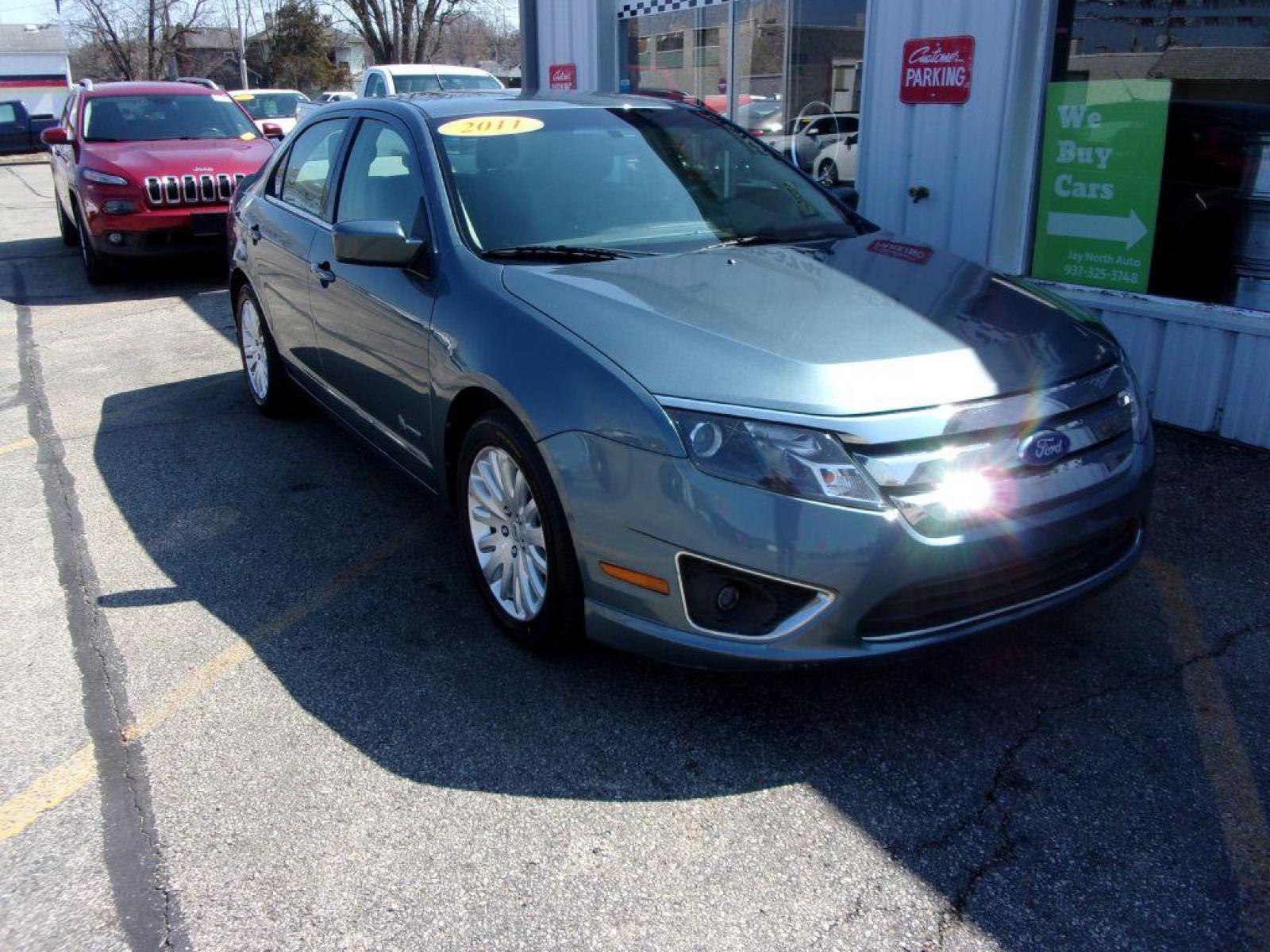 2011 BLUE FORD FUSION HYBRID (3FADP0L39BR) with an 2.5L engine, Continuously Variable transmission, located at 501 E. Columbia St., Springfield, OH, 45503, (800) 262-7122, 39.925262, -83.801796 - ***HYBRID***New Tires***Serviced and Detailed*** Jay North Auto has offered hand picked vehicles since 1965! Our customer's enjoy a NO pressure buying experience with a small town feel. All of our vehicles get fully inspected and detailed. We are a preferred dealer for many local credit unions a - Photo #2
