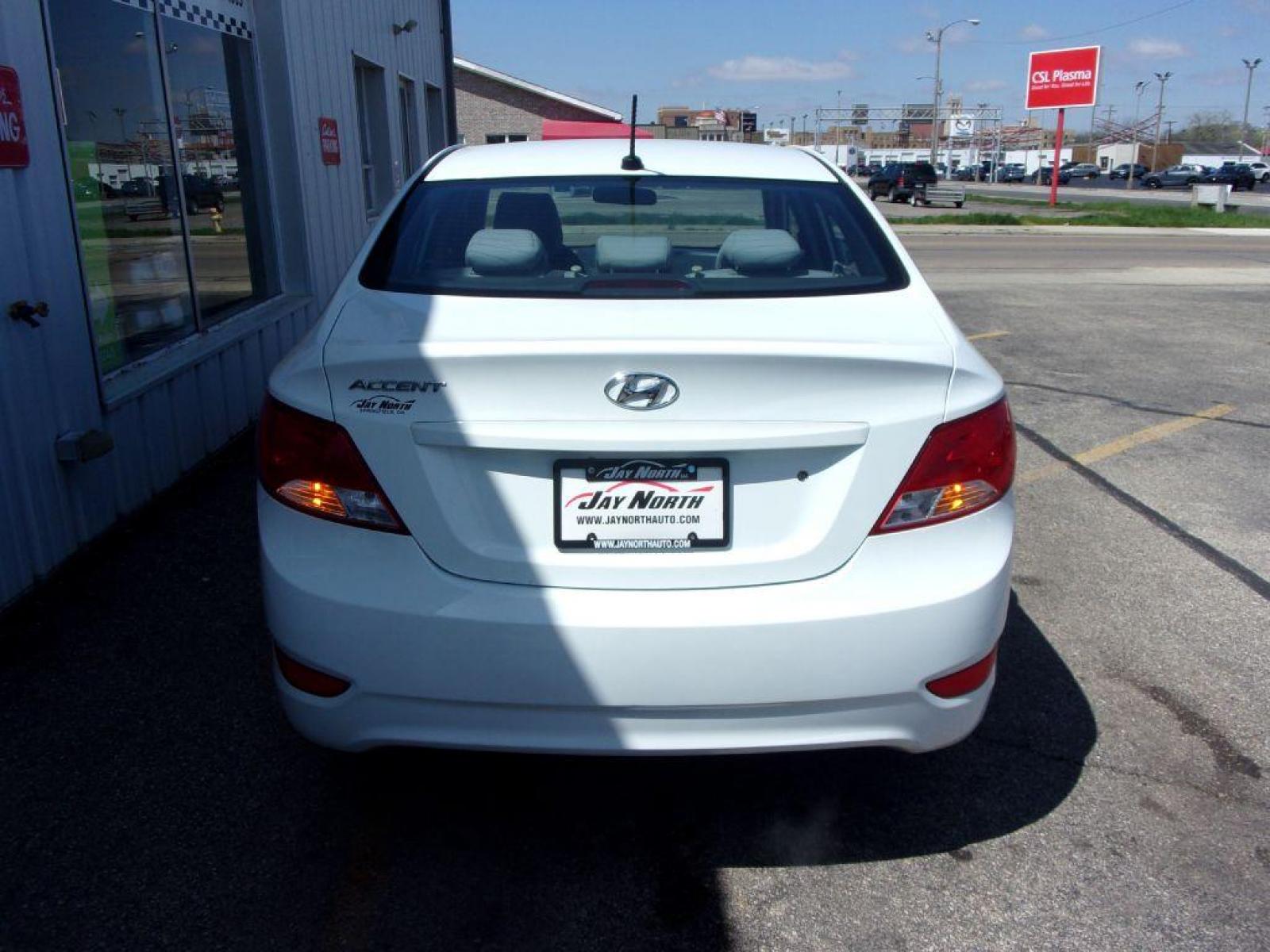 2015 WHITE HYUNDAI ACCENT GLS (KMHCT4AE2FU) with an 1.6L engine, Automatic transmission, located at 501 E. Columbia St., Springfield, OH, 45503, (800) 262-7122, 39.925262, -83.801796 - *** New Tires *** Serviced and Detailed *** Automatic *** Power Windows and Locks *** Jay North Auto has offered hand picked vehicles since 1965! Our customer's enjoy a NO pressure buying experience with a small town feel. All of our vehicles get fully inspected and detailed. We are a preferred - Photo #4