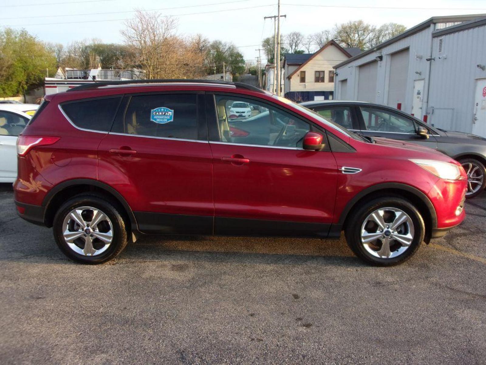 2014 RED FORD ESCAPE SE (1FMCU9G95EU) with an 2.0L engine, Automatic transmission, located at 501 E. Columbia St., Springfield, OH, 45503, (800) 262-7122, 39.925262, -83.801796 - *** Heated Leather *** 4WD *** Serviced and Detailed *** 2.0L Ecoboost *** SE *** NICE!!! *** Sync w/ Back Up Cam and touchscreen *** Reverse sensing *** Jay North Auto has offered hand picked vehicles since 1965! Our customer's enjoy a NO pressure buying experience with a small town feel. All - Photo #0