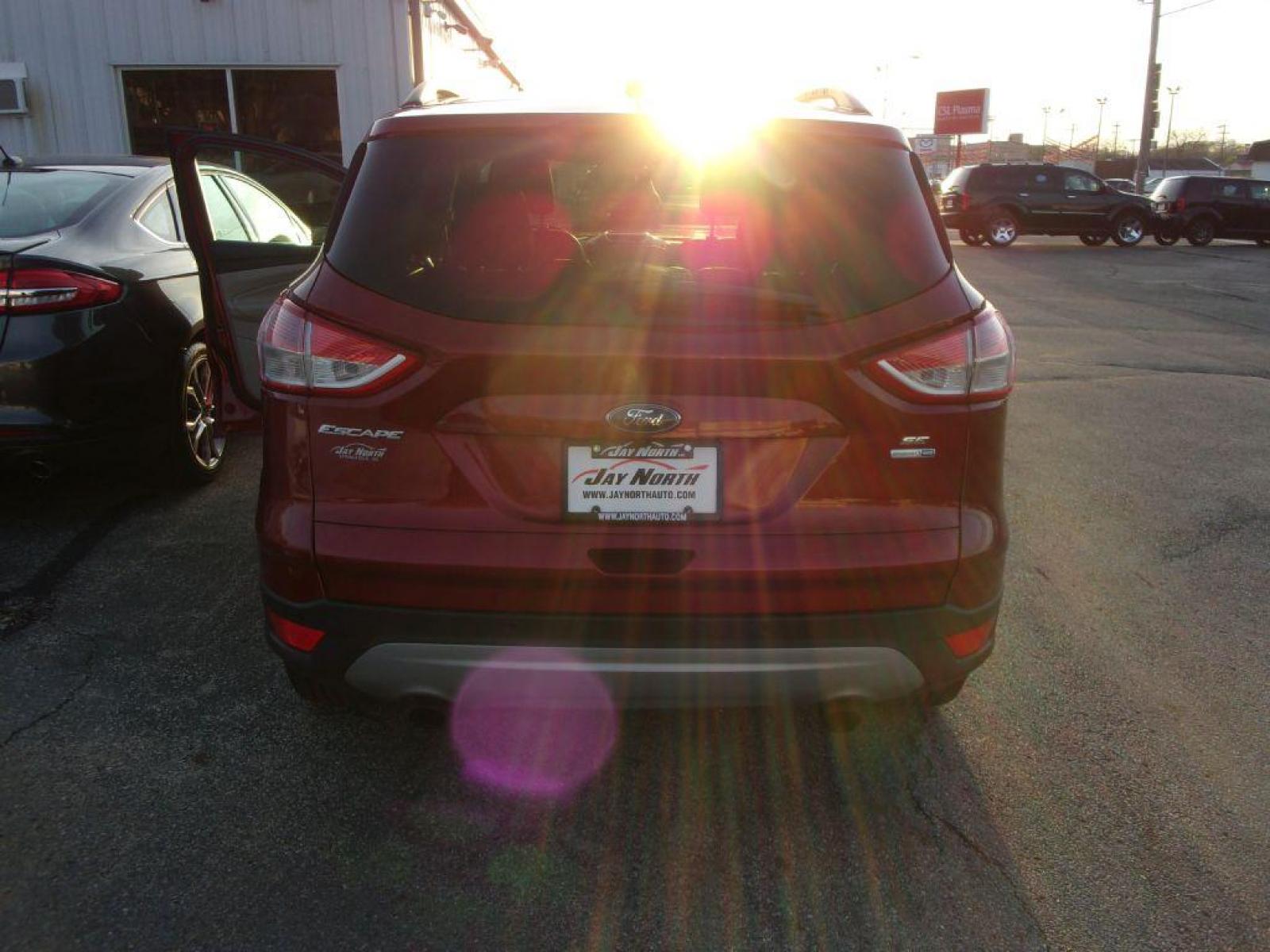2014 RED FORD ESCAPE SE (1FMCU9G95EU) with an 2.0L engine, Automatic transmission, located at 501 E. Columbia St., Springfield, OH, 45503, (800) 262-7122, 39.925262, -83.801796 - *** Heated Leather *** 4WD *** Serviced and Detailed *** 2.0L Ecoboost *** SE *** NICE!!! *** Sync w/ Back Up Cam and touchscreen *** Reverse sensing *** Jay North Auto has offered hand picked vehicles since 1965! Our customer's enjoy a NO pressure buying experience with a small town feel. All - Photo #6