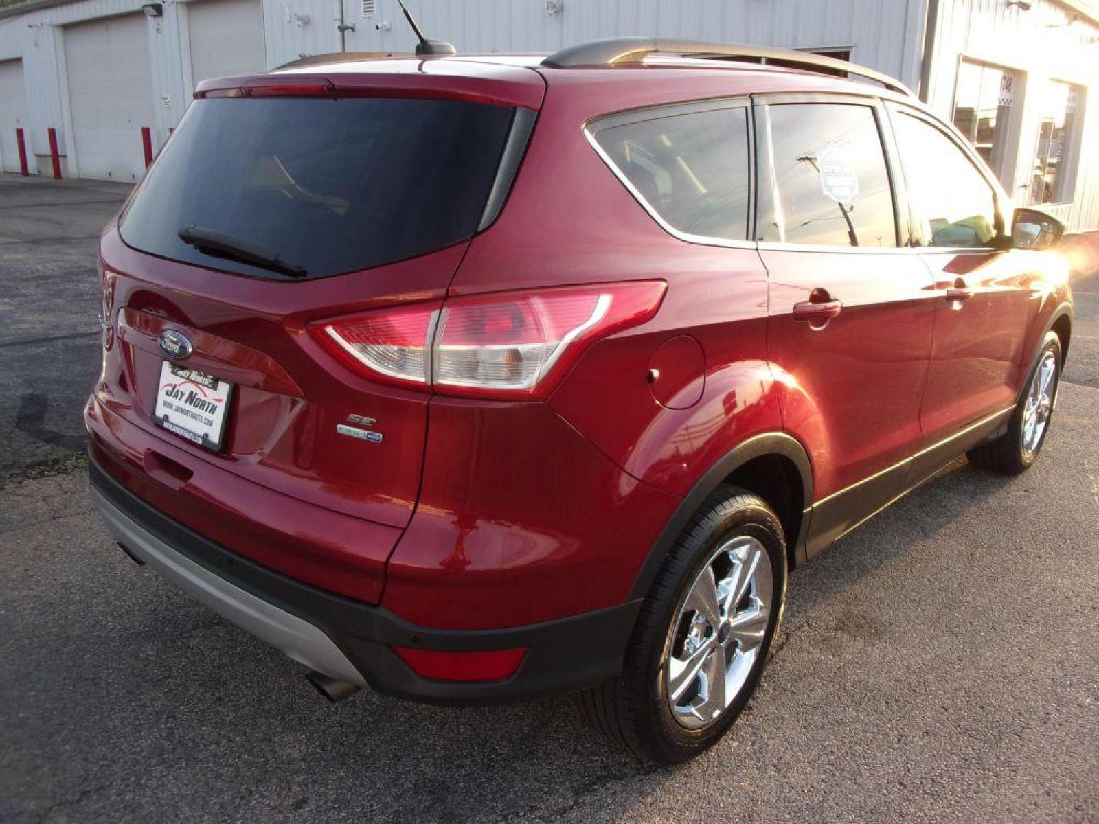 2014 RED FORD ESCAPE SE (1FMCU9G95EU) with an 2.0L engine, Automatic transmission, located at 501 E. Columbia St., Springfield, OH, 45503, (800) 262-7122, 39.925262, -83.801796 - *** Heated Leather *** 4WD *** Serviced and Detailed *** 2.0L Ecoboost *** SE *** NICE!!! *** Sync w/ Back Up Cam and touchscreen *** Reverse sensing *** Jay North Auto has offered hand picked vehicles since 1965! Our customer's enjoy a NO pressure buying experience with a small town feel. All - Photo #8