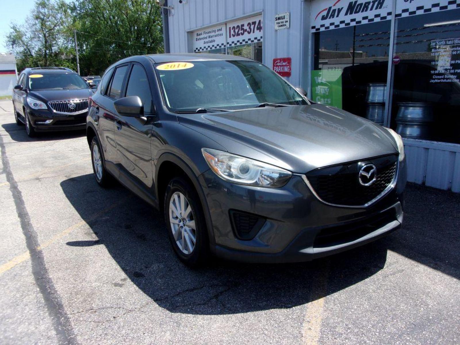 2014 GRAY MAZDA CX-5 SPORT (JM3KE2BEXE0) with an 2.0L engine, 6-Speed Manual transmission, located at 501 E. Columbia St., Springfield, OH, 45503, (800) 262-7122, 39.925262, -83.801796 - *** 6 - Speed Manual ** Sport *** Serviced and Detailed *** FWD *** 2.0L *** Jay North Auto has offered hand picked vehicles since 1965! Our customer's enjoy a NO pressure buying experience with a small town feel. All of our vehicles get fully inspected and detailed. We are a preferred dealer f - Photo #2