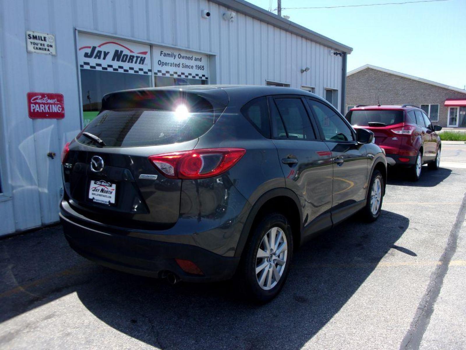 2014 GRAY MAZDA CX-5 SPORT (JM3KE2BEXE0) with an 2.0L engine, 6-Speed Manual transmission, located at 501 E. Columbia St., Springfield, OH, 45503, (800) 262-7122, 39.925262, -83.801796 - *** 6 - Speed Manual ** Sport *** Serviced and Detailed *** FWD *** 2.0L *** Jay North Auto has offered hand picked vehicles since 1965! Our customer's enjoy a NO pressure buying experience with a small town feel. All of our vehicles get fully inspected and detailed. We are a preferred dealer f - Photo #3