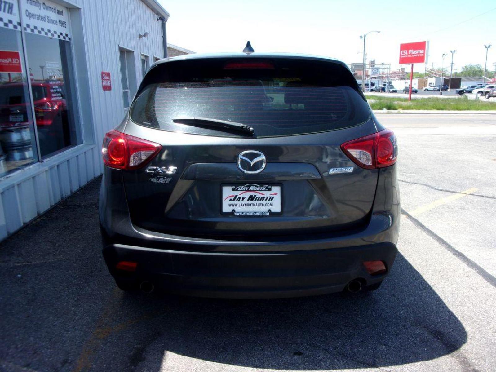 2014 GRAY MAZDA CX-5 SPORT (JM3KE2BEXE0) with an 2.0L engine, 6-Speed Manual transmission, located at 501 E. Columbia St., Springfield, OH, 45503, (800) 262-7122, 39.925262, -83.801796 - *** 6 - Speed Manual ** Sport *** Serviced and Detailed *** FWD *** 2.0L *** Jay North Auto has offered hand picked vehicles since 1965! Our customer's enjoy a NO pressure buying experience with a small town feel. All of our vehicles get fully inspected and detailed. We are a preferred dealer f - Photo #4