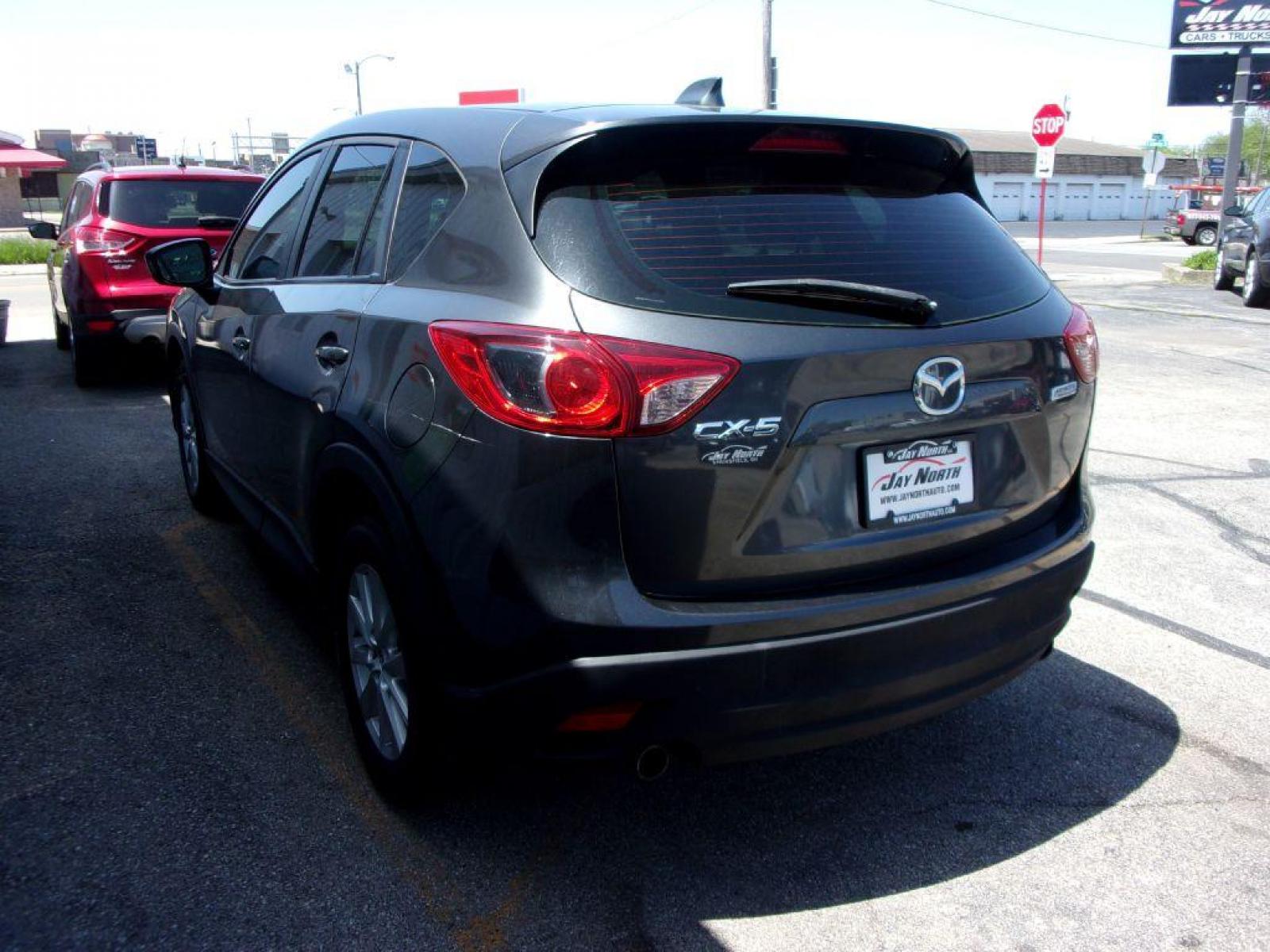2014 GRAY MAZDA CX-5 SPORT (JM3KE2BEXE0) with an 2.0L engine, 6-Speed Manual transmission, located at 501 E. Columbia St., Springfield, OH, 45503, (800) 262-7122, 39.925262, -83.801796 - *** 6 - Speed Manual ** Sport *** Serviced and Detailed *** FWD *** 2.0L *** Jay North Auto has offered hand picked vehicles since 1965! Our customer's enjoy a NO pressure buying experience with a small town feel. All of our vehicles get fully inspected and detailed. We are a preferred dealer f - Photo #5