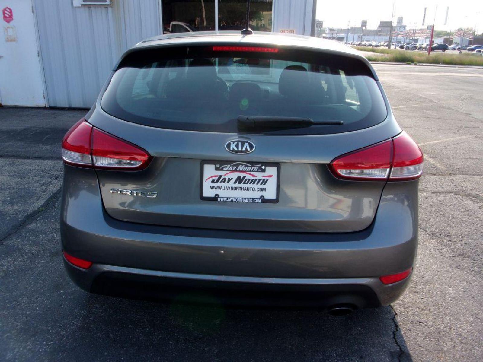 2016 GRAY KIA FORTE LX (KNAFK5A8XG5) with an 2.0L engine, Automatic transmission, located at 501 E. Columbia St., Springfield, OH, 45503, (800) 262-7122, 39.925262, -83.801796 - *** Hatchback *** Serviced and Detailed *** Great MPG *** 2.0L FWD *** Jay North Auto has offered hand picked vehicles since 1965! Our customer's enjoy a NO pressure buying experience with a small town feel. All of our vehicles get fully inspected and detailed. We are a preferred dealer for many - Photo #3