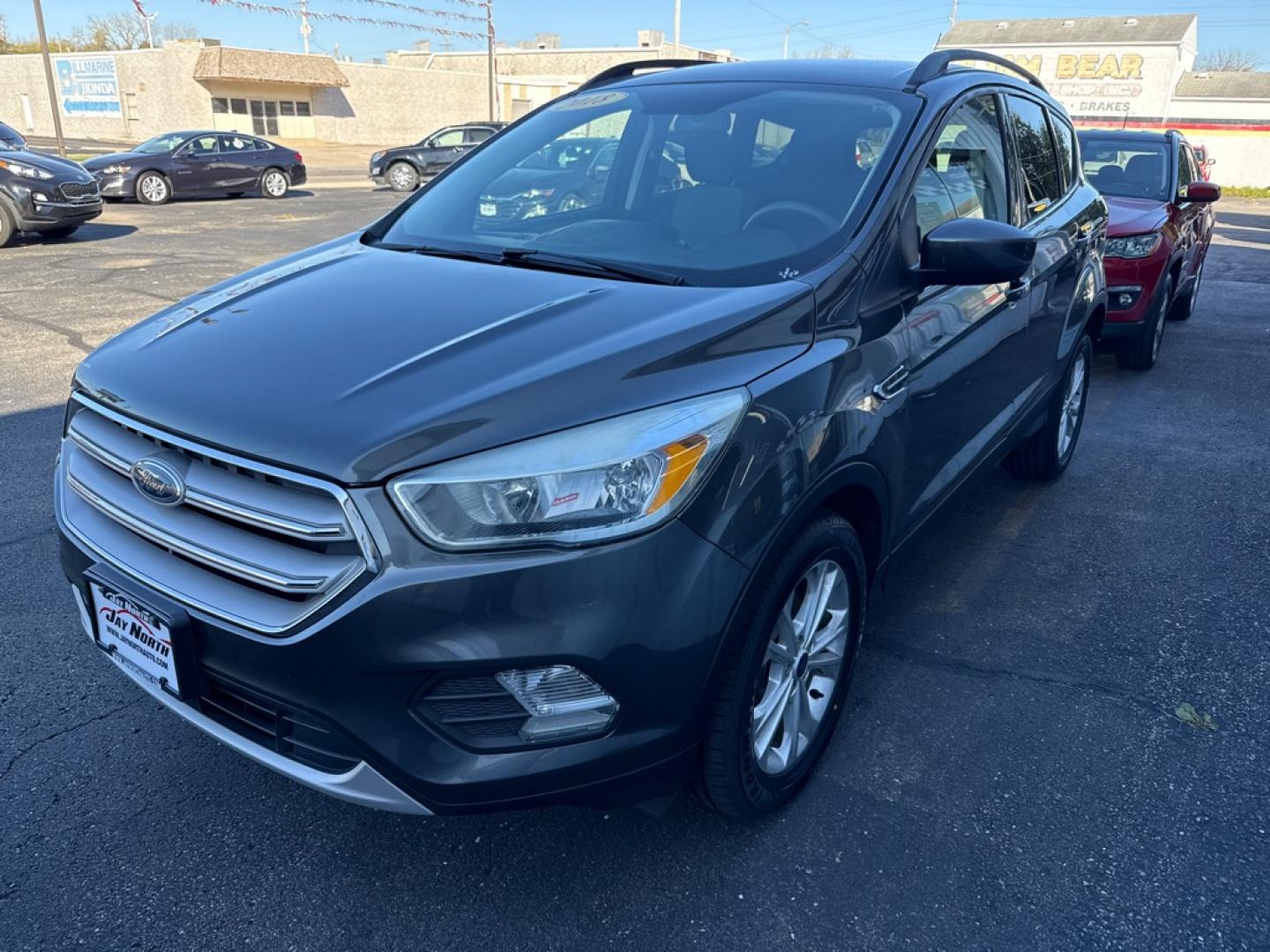 2018 GRAY FORD ESCAPE SE (1FMCU0GD8JU) with an 1.5L engine, Automatic transmission, located at 501 E. Columbia St., Springfield, OH, 45503, (800) 262-7122, 39.925262, -83.801796 - Jay North Auto has offered hand picked vehicles since 1965! Our customer's enjoy a NO pressure buying experience with a small town feel. We are a preferred dealer for many local credit unions and lenders. Bad credit? No Credit/First time buyer? Open or closed BANKRUPTCY 7 or 13? We Can Help Apply- Photo#2