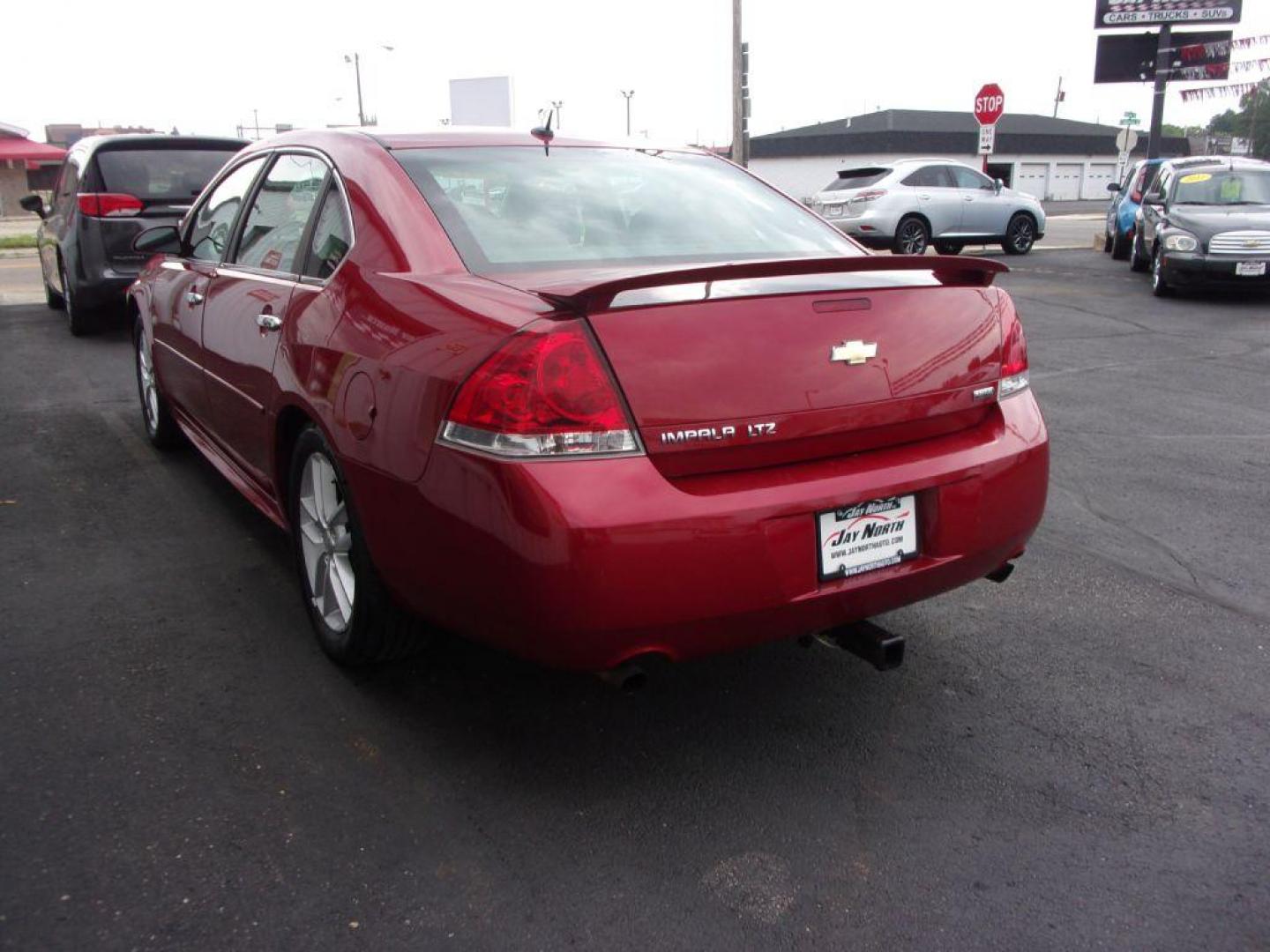 2012 RED CHEVROLET IMPALA LTZ (2G1WC5E38C1) with an 3.6L engine, Automatic transmission, located at 501 E. Columbia St., Springfield, OH, 45503, (800) 262-7122, 39.925262, -83.801796 - Photo#5