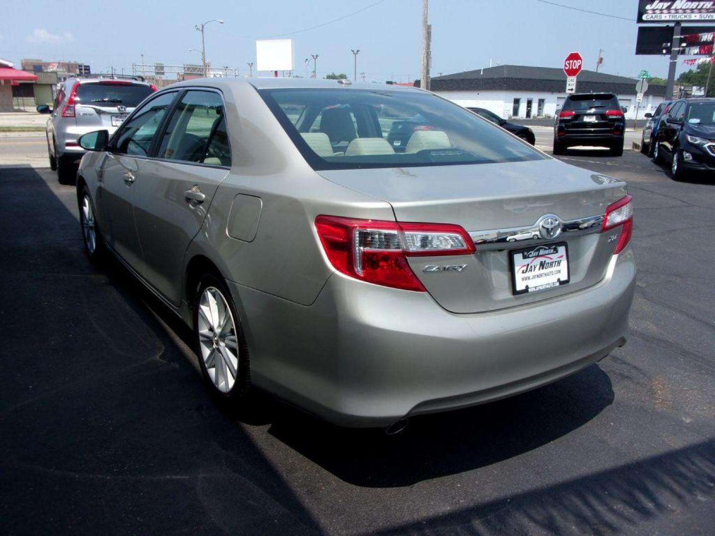 2013 GOLD TOYOTA CAMRY XLE (4T1BK1FK0DU) with an 3.5L engine, Automatic transmission, located at 501 E. Columbia St., Springfield, OH, 45503, (800) 262-7122, 39.925262, -83.801796 - ***XLE***54 Records on Carfax***New Front Pads and Rotors***Heated Leather Seats***Moonroof***Serviced and Detailed*** Jay North Auto has offered hand picked vehicles since 1965! Our customer's enjoy a NO pressure buying experience with a small town feel. All of our vehicles get fully inspected - Photo#5