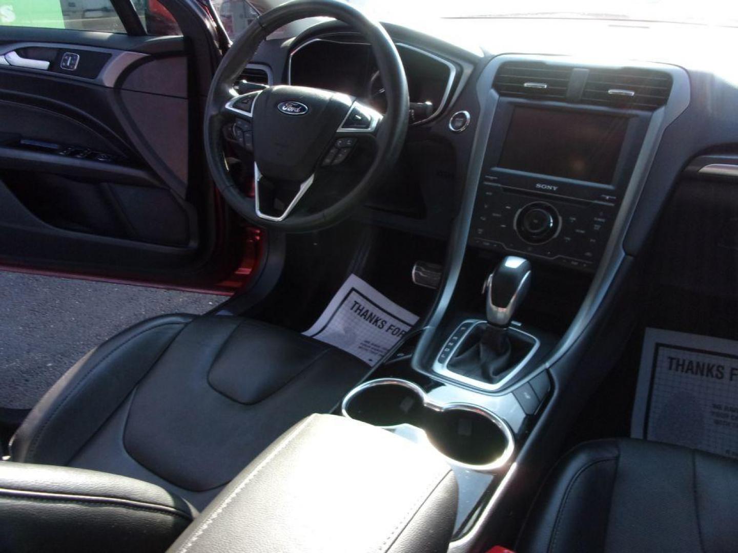 2014 RED FORD FUSION TITANIUM HYBRID (3FA6P0RU3ER) with an 2.0L engine, Continuously Variable transmission, located at 501 E. Columbia St., Springfield, OH, 45503, (800) 262-7122, 39.925262, -83.801796 - ***1-Owner***TITANIUM HYBRID***New Tires***Heated Leather Seating***Back-up Camera***Serviced and Detailed*** Jay North Auto has offered hand picked vehicles since 1965! Our customer's enjoy a NO pressure buying experience with a small town feel. All of our vehicles get fully inspected and detai - Photo#16