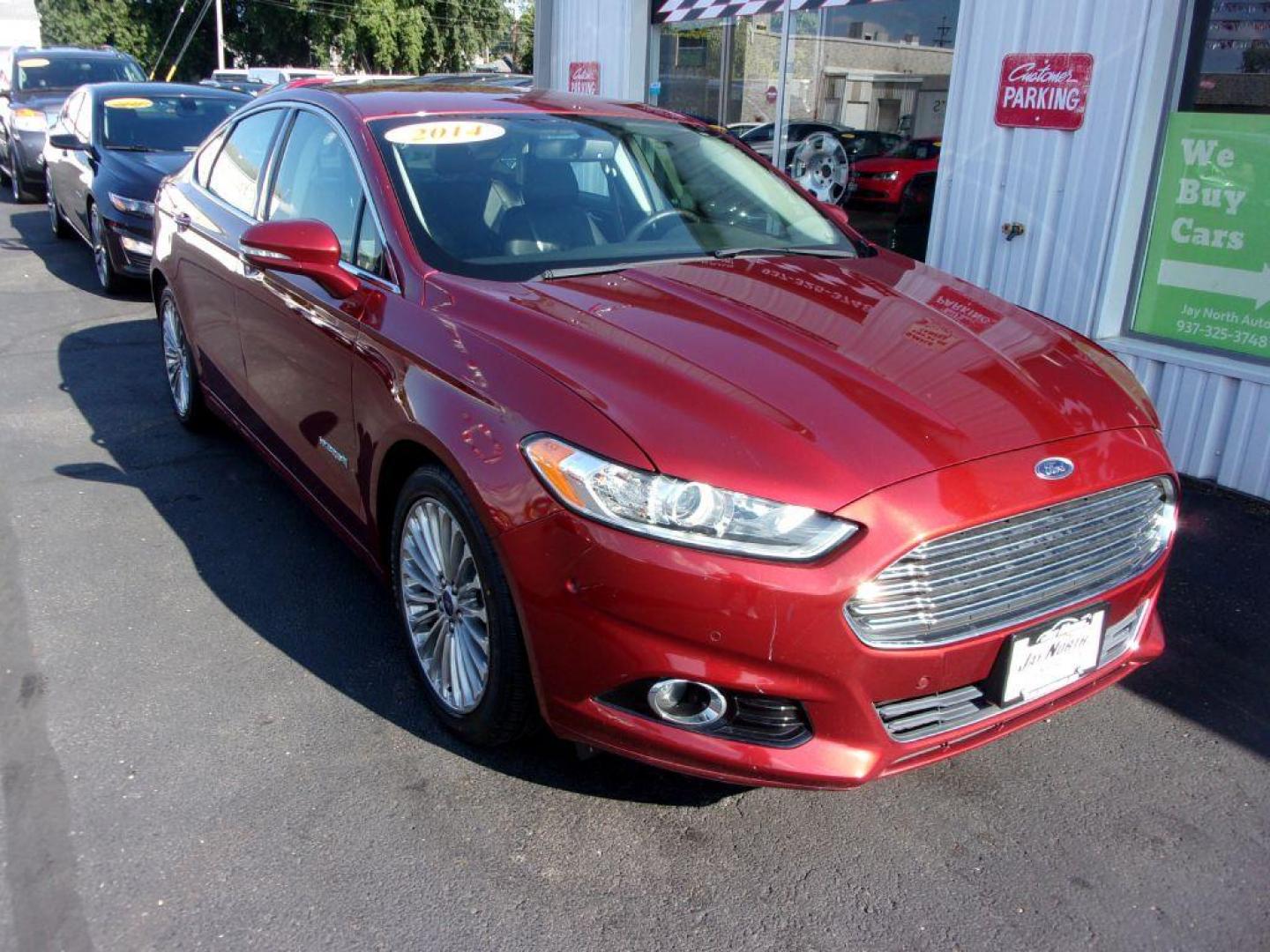 2014 RED FORD FUSION TITANIUM HYBRID (3FA6P0RU3ER) with an 2.0L engine, Continuously Variable transmission, located at 501 E. Columbia St., Springfield, OH, 45503, (800) 262-7122, 39.925262, -83.801796 - ***1-Owner***TITANIUM HYBRID***New Tires***Heated Leather Seating***Back-up Camera***Serviced and Detailed*** Jay North Auto has offered hand picked vehicles since 1965! Our customer's enjoy a NO pressure buying experience with a small town feel. All of our vehicles get fully inspected and detai - Photo#2