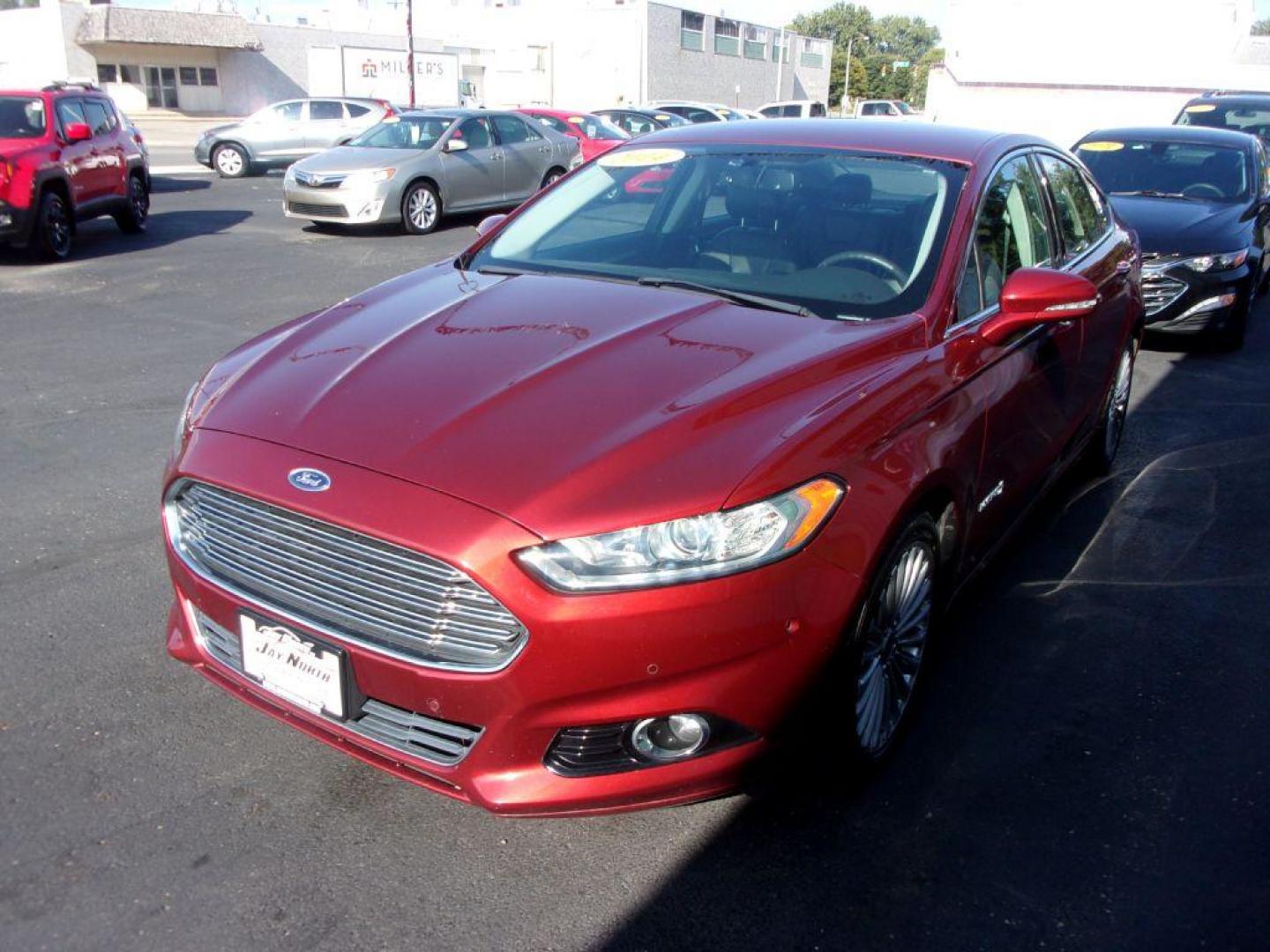 2014 RED FORD FUSION TITANIUM HYBRID (3FA6P0RU3ER) with an 2.0L engine, Continuously Variable transmission, located at 501 E. Columbia St., Springfield, OH, 45503, (800) 262-7122, 39.925262, -83.801796 - ***1-Owner***TITANIUM HYBRID***New Tires***Heated Leather Seating***Back-up Camera***Serviced and Detailed*** Jay North Auto has offered hand picked vehicles since 1965! Our customer's enjoy a NO pressure buying experience with a small town feel. All of our vehicles get fully inspected and detai - Photo#4