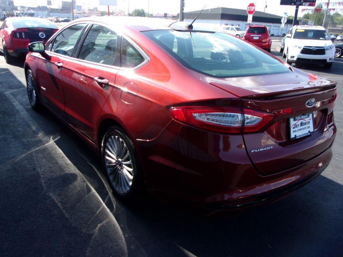 2014 RED FORD FUSION TITANIUM HYBRID (3FA6P0RU3ER) with an 2.0L engine, Continuously Variable transmission, located at 501 E. Columbia St., Springfield, OH, 45503, (800) 262-7122, 39.925262, -83.801796 - ***1-Owner***TITANIUM HYBRID***New Tires***Heated Leather Seating***Back-up Camera***Serviced and Detailed*** Jay North Auto has offered hand picked vehicles since 1965! Our customer's enjoy a NO pressure buying experience with a small town feel. All of our vehicles get fully inspected and detai - Photo#5