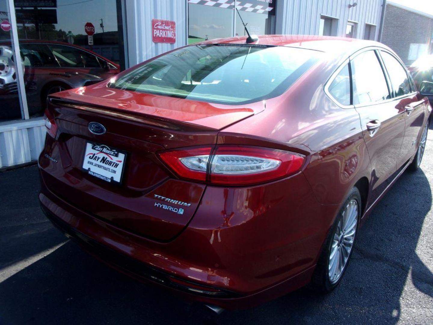 2014 RED FORD FUSION TITANIUM HYBRID (3FA6P0RU3ER) with an 2.0L engine, Continuously Variable transmission, located at 501 E. Columbia St., Springfield, OH, 45503, (800) 262-7122, 39.925262, -83.801796 - ***1-Owner***TITANIUM HYBRID***New Tires***Heated Leather Seating***Back-up Camera***Serviced and Detailed*** Jay North Auto has offered hand picked vehicles since 1965! Our customer's enjoy a NO pressure buying experience with a small town feel. All of our vehicles get fully inspected and detai - Photo#7