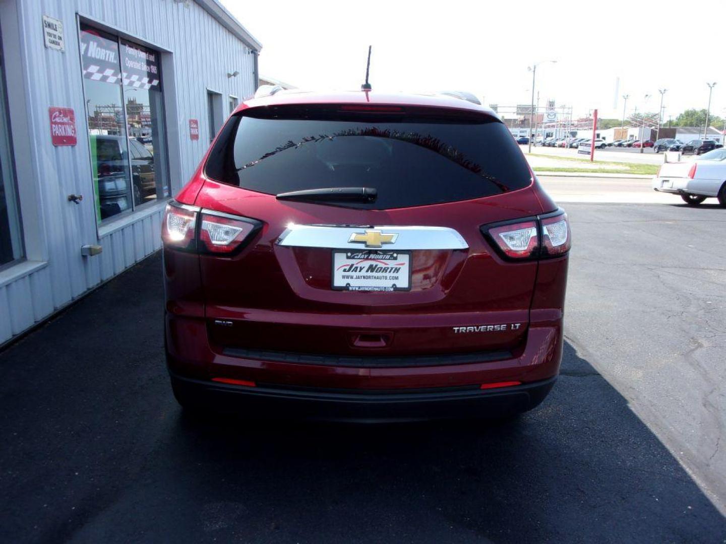 2015 RED CHEVROLET TRAVERSE LT (1GNKVGKDXFJ) with an 3.6L engine, Automatic transmission, located at 501 E. Columbia St., Springfield, OH, 45503, (800) 262-7122, 39.925262, -83.801796 - ***Clean Carfax***Heated Seats***Back-up Camera***46 Service Records on Carfax***3rd Row***Serviced and Detailed*** Jay North Auto has offered hand picked vehicles since 1965! Our customer's enjoy a NO pressure buying experience with a small town feel. All of our vehicles get fully inspected and - Photo#4