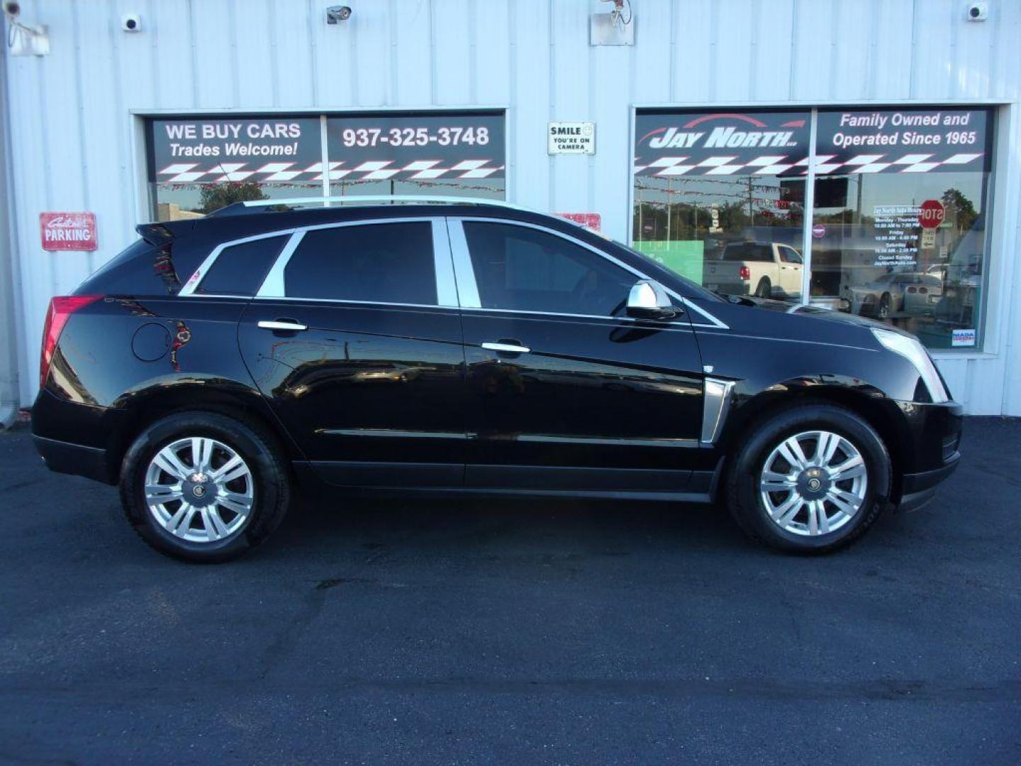 2016 BLACK CADILLAC SRX LUXURY COLLECTION (3GYFNEE32GS) with an 3.6L engine, Automatic transmission, located at 501 E. Columbia St., Springfield, OH, 45503, (800) 262-7122, 39.925262, -83.801796 - *** Luxury Collection *** Panoramic Moonroof *** Bose Audio with Back Up Camera *** Power Lift Gate *** V6 AWD *** Serviced and Detailed *** Remote Start *** New Headlight Housings *** Jay North Auto has offered hand picked vehicles since 1965! Our customer's enjoy a NO pressure buying experienc - Photo#0