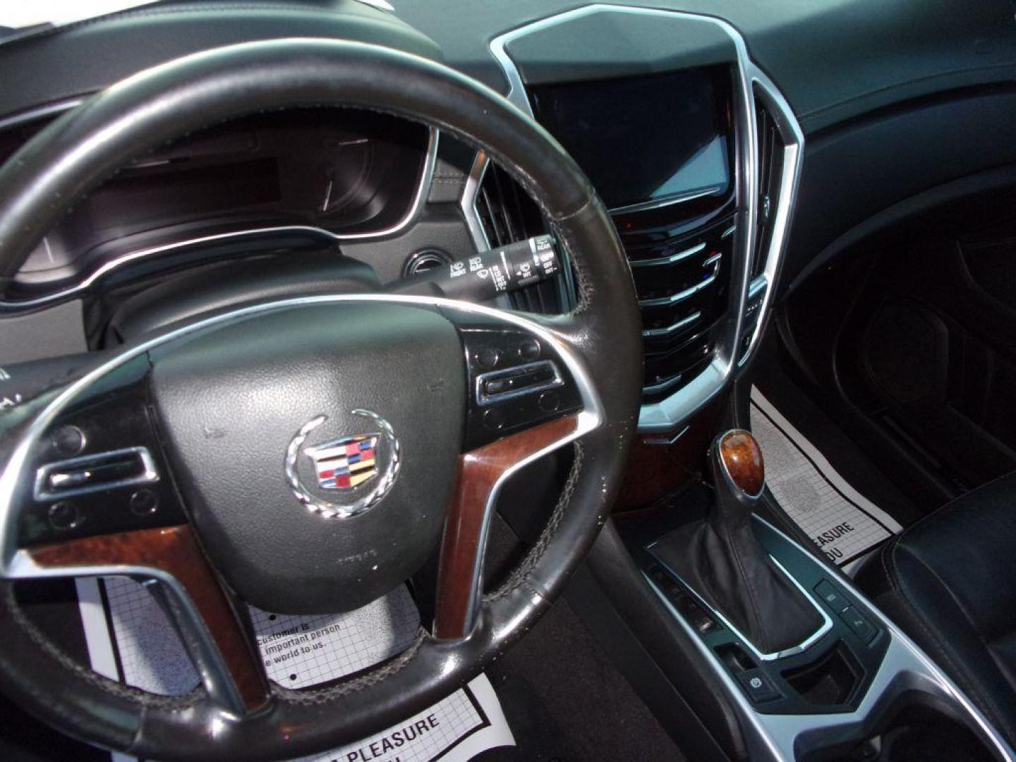 2016 BLACK CADILLAC SRX LUXURY COLLECTION (3GYFNEE32GS) with an 3.6L engine, Automatic transmission, located at 501 E. Columbia St., Springfield, OH, 45503, (800) 262-7122, 39.925262, -83.801796 - *** Luxury Collection *** Panoramic Moonroof *** Bose Audio with Back Up Camera *** Power Lift Gate *** V6 AWD *** Serviced and Detailed *** Remote Start *** New Headlight Housings *** Jay North Auto has offered hand picked vehicles since 1965! Our customer's enjoy a NO pressure buying experienc - Photo#9