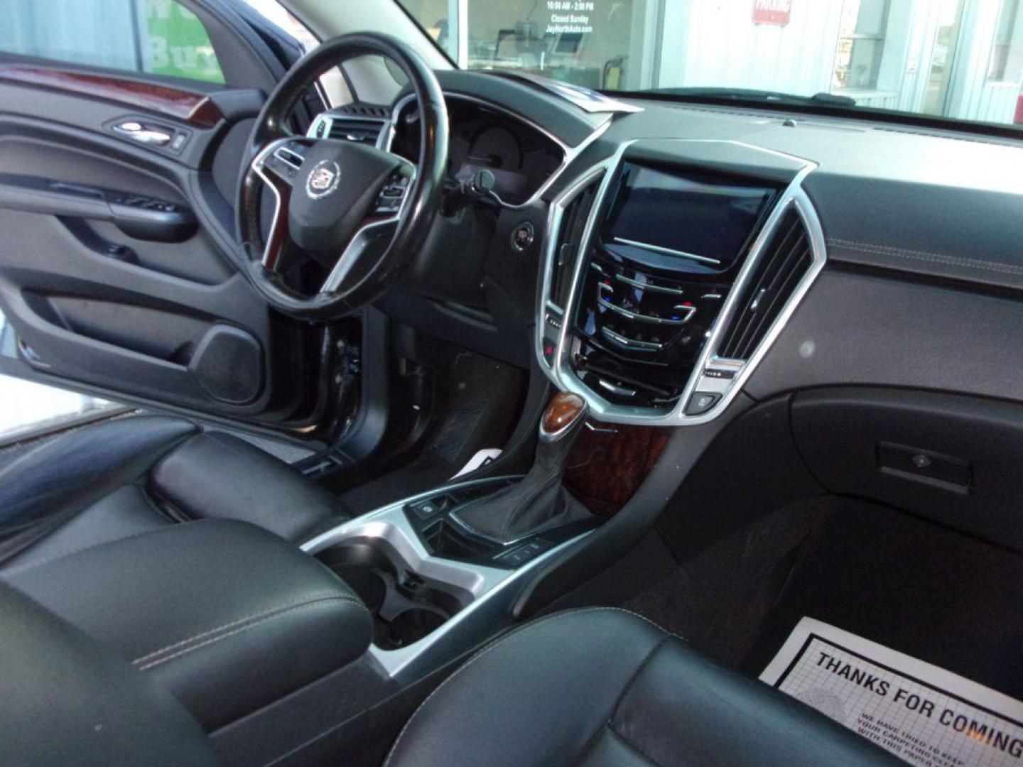 2016 BLACK CADILLAC SRX LUXURY COLLECTION (3GYFNEE32GS) with an 3.6L engine, Automatic transmission, located at 501 E. Columbia St., Springfield, OH, 45503, (800) 262-7122, 39.925262, -83.801796 - *** Luxury Collection *** Panoramic Moonroof *** Bose Audio with Back Up Camera *** Power Lift Gate *** V6 AWD *** Serviced and Detailed *** Remote Start *** New Headlight Housings *** Jay North Auto has offered hand picked vehicles since 1965! Our customer's enjoy a NO pressure buying experienc - Photo#11