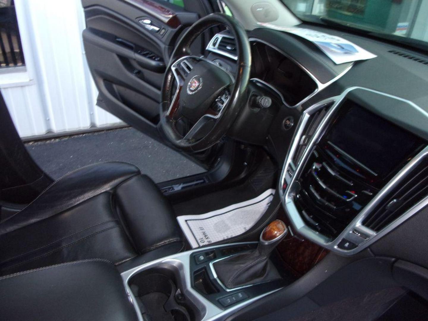 2016 BLACK CADILLAC SRX LUXURY COLLECTION (3GYFNEE32GS) with an 3.6L engine, Automatic transmission, located at 501 E. Columbia St., Springfield, OH, 45503, (800) 262-7122, 39.925262, -83.801796 - *** Luxury Collection *** Panoramic Moonroof *** Bose Audio with Back Up Camera *** Power Lift Gate *** V6 AWD *** Serviced and Detailed *** Remote Start *** New Headlight Housings *** Jay North Auto has offered hand picked vehicles since 1965! Our customer's enjoy a NO pressure buying experienc - Photo#14