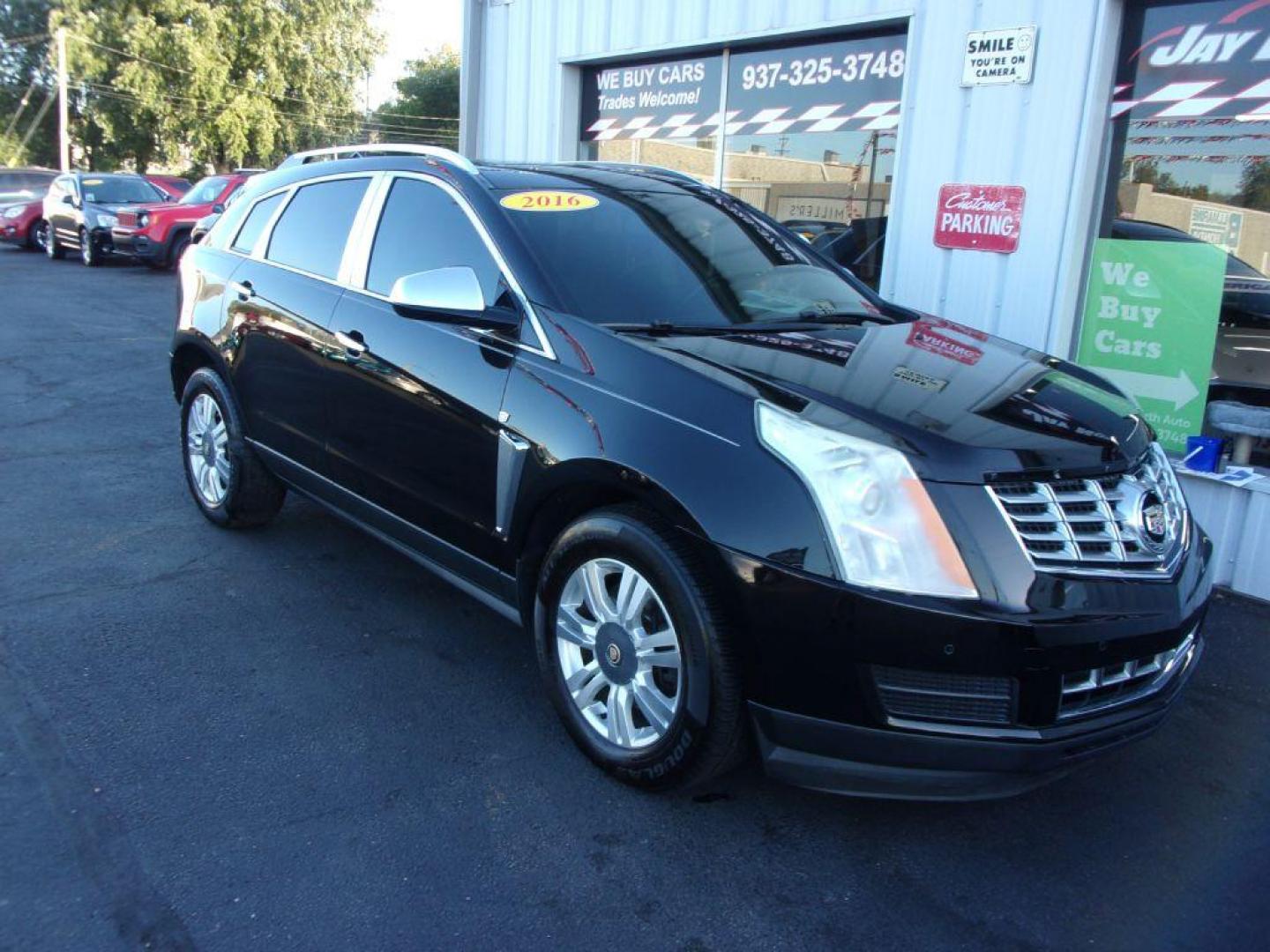2016 BLACK CADILLAC SRX LUXURY COLLECTION (3GYFNEE32GS) with an 3.6L engine, Automatic transmission, located at 501 E. Columbia St., Springfield, OH, 45503, (800) 262-7122, 39.925262, -83.801796 - *** Luxury Collection *** Panoramic Moonroof *** Bose Audio with Back Up Camera *** Power Lift Gate *** V6 AWD *** Serviced and Detailed *** Remote Start *** New Headlight Housings *** Jay North Auto has offered hand picked vehicles since 1965! Our customer's enjoy a NO pressure buying experienc - Photo#1