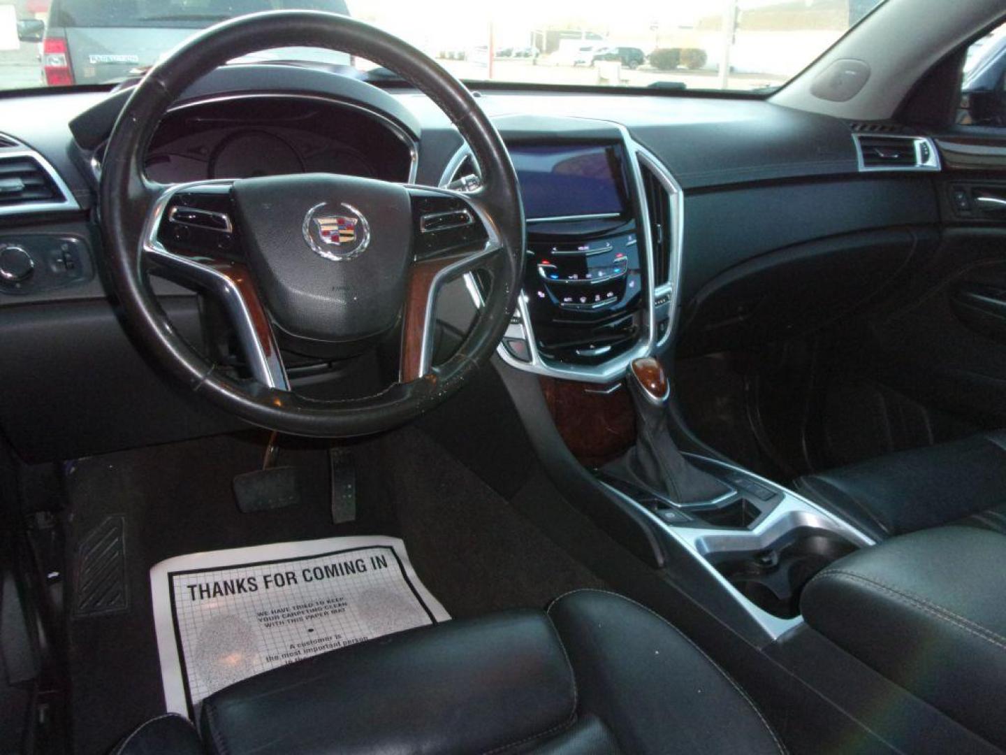 2016 BLACK CADILLAC SRX LUXURY COLLECTION (3GYFNEE32GS) with an 3.6L engine, Automatic transmission, located at 501 E. Columbia St., Springfield, OH, 45503, (800) 262-7122, 39.925262, -83.801796 - *** Luxury Collection *** Panoramic Moonroof *** Bose Audio with Back Up Camera *** Power Lift Gate *** V6 AWD *** Serviced and Detailed *** Remote Start *** New Headlight Housings *** Jay North Auto has offered hand picked vehicles since 1965! Our customer's enjoy a NO pressure buying experienc - Photo#5