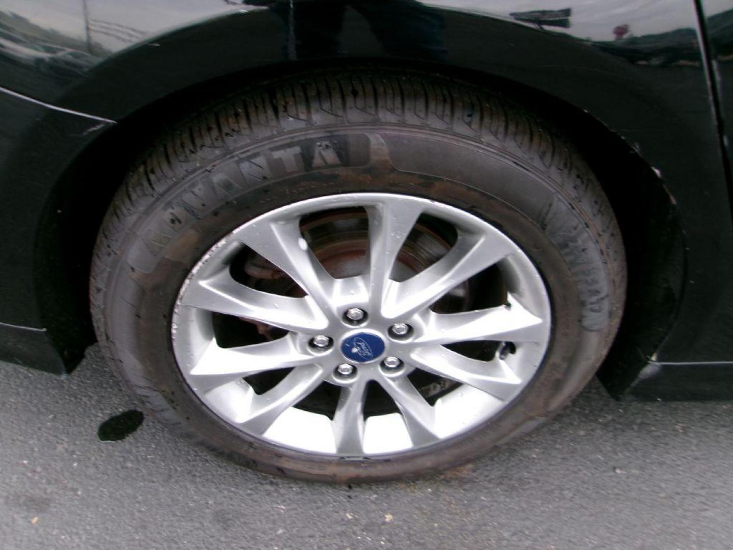 2017 BLACK FORD FUSION SE HYBRID (3FA6P0LU1HR) with an 2.0L engine, Continuously Variable transmission, located at 501 E. Columbia St., Springfield, OH, 45503, (800) 262-7122, 39.925262, -83.801796 - ***Hybrid***SE***New Brakes***Back-up Camera***SYNC 3***Serviced and Detailed*** Jay North Auto has offered hand picked vehicles since 1965! Our customer's enjoy a NO pressure buying experience with a small town feel. All of our vehicles get fully inspected and detailed. We are a preferred dea - Photo#18