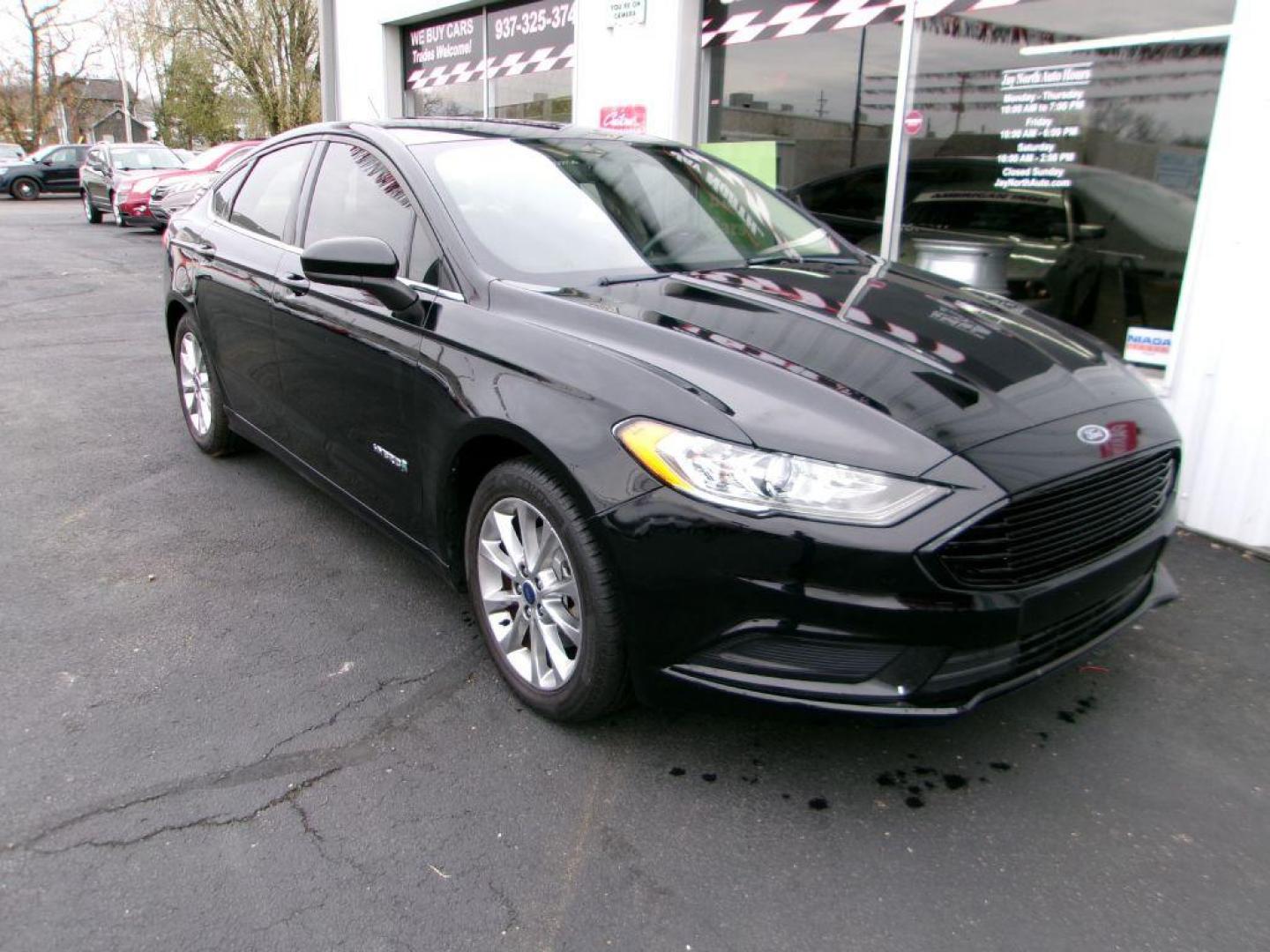 2017 BLACK FORD FUSION SE HYBRID (3FA6P0LU1HR) with an 2.0L engine, Continuously Variable transmission, located at 501 E. Columbia St., Springfield, OH, 45503, (800) 262-7122, 39.925262, -83.801796 - ***Hybrid***SE***New Brakes***Back-up Camera***SYNC 3***Serviced and Detailed*** Jay North Auto has offered hand picked vehicles since 1965! Our customer's enjoy a NO pressure buying experience with a small town feel. All of our vehicles get fully inspected and detailed. We are a preferred dea - Photo#2