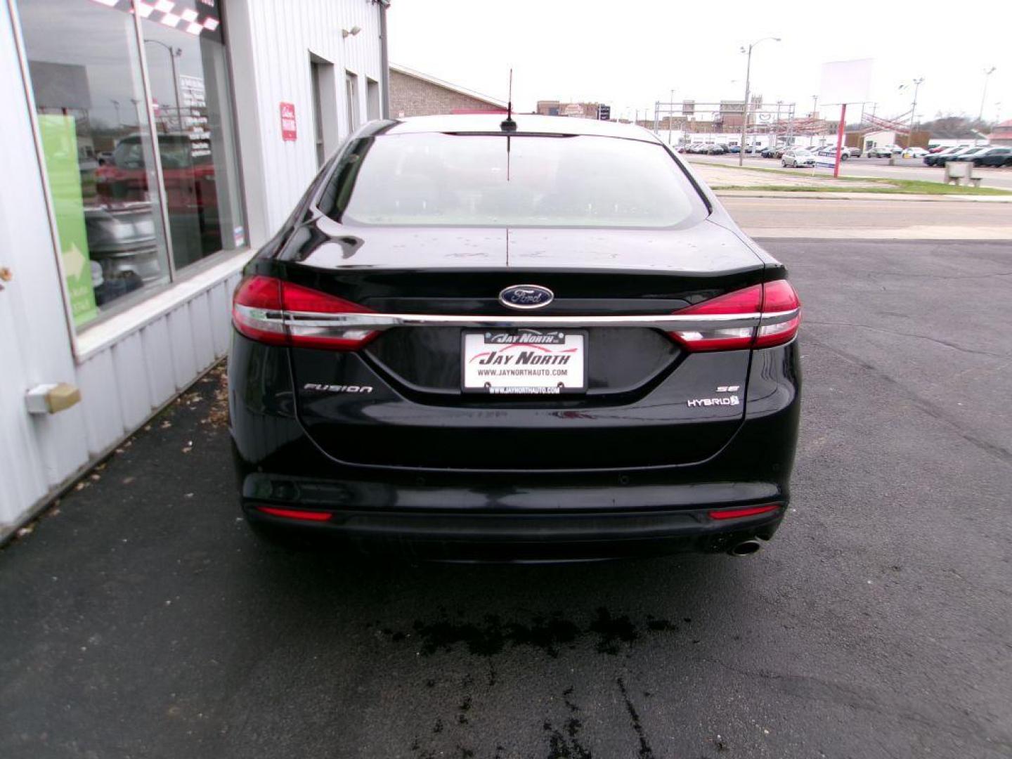 2017 BLACK FORD FUSION SE HYBRID (3FA6P0LU1HR) with an 2.0L engine, Continuously Variable transmission, located at 501 E. Columbia St., Springfield, OH, 45503, (800) 262-7122, 39.925262, -83.801796 - ***Hybrid***SE***New Brakes***Back-up Camera***SYNC 3***Serviced and Detailed*** Jay North Auto has offered hand picked vehicles since 1965! Our customer's enjoy a NO pressure buying experience with a small town feel. All of our vehicles get fully inspected and detailed. We are a preferred dea - Photo#4