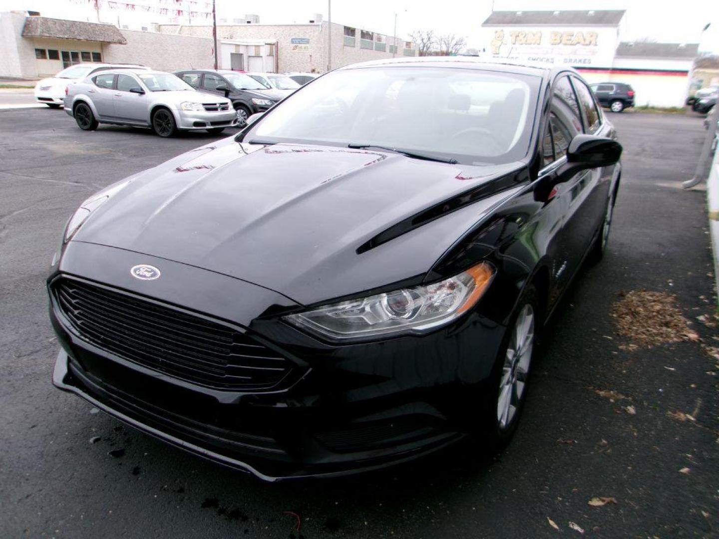 2017 BLACK FORD FUSION SE HYBRID (3FA6P0LU1HR) with an 2.0L engine, Continuously Variable transmission, located at 501 E. Columbia St., Springfield, OH, 45503, (800) 262-7122, 39.925262, -83.801796 - ***Hybrid***SE***New Brakes***Back-up Camera***SYNC 3***Serviced and Detailed*** Jay North Auto has offered hand picked vehicles since 1965! Our customer's enjoy a NO pressure buying experience with a small town feel. All of our vehicles get fully inspected and detailed. We are a preferred dea - Photo#6