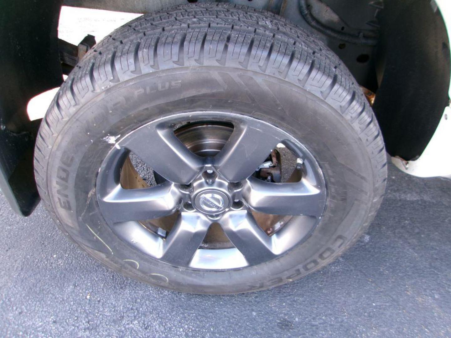 2012 WHITE NISSAN TITAN SV (1N6AA0CJ2CN) with an 5.6L engine, Automatic transmission, located at 501 E. Columbia St., Springfield, OH, 45503, (800) 262-7122, 39.925262, -83.801796 - ***SV***Clean Carfax***Like New Tires***New Front and Rear Pads and Rotors***4X4***Serviced and Detailed*** Jay North Auto has offered hand picked vehicles since 1965! Our customer's enjoy a NO pressure buying experience with a small town feel. All of our vehicles get fully inspected and detaile - Photo#17