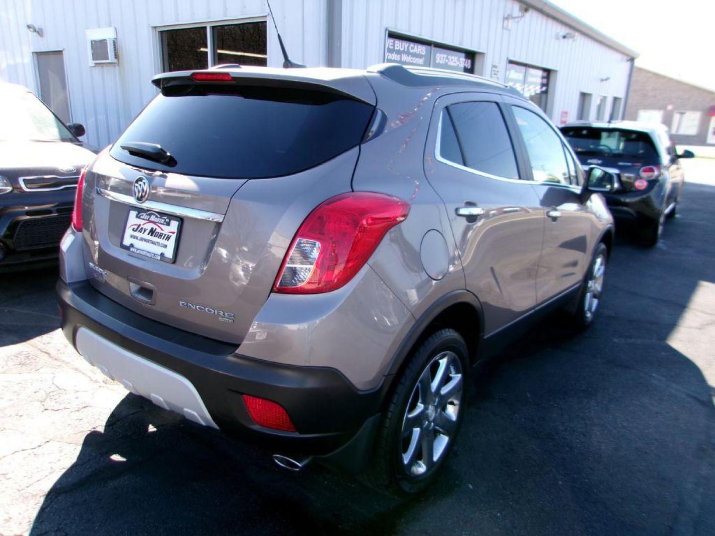 2014 BROWN BUICK ENCORE LEATHER GROUP (KL4CJGSB3EB) with an 1.4L engine, Automatic transmission, located at 501 E. Columbia St., Springfield, OH, 45503, (800) 262-7122, 39.925262, -83.801796 - *** New Turbo *** New Front Pads and Rotors *** Tune Up *** New Water Pump *** New Catalytic Converter *** Serviced and Detailed *** Leather *** Moonroof *** Remote Start *** Jay North Auto has offered hand picked vehicles since 1965! Our customer's enjoy a NO pressure buying experience with a - Photo#3
