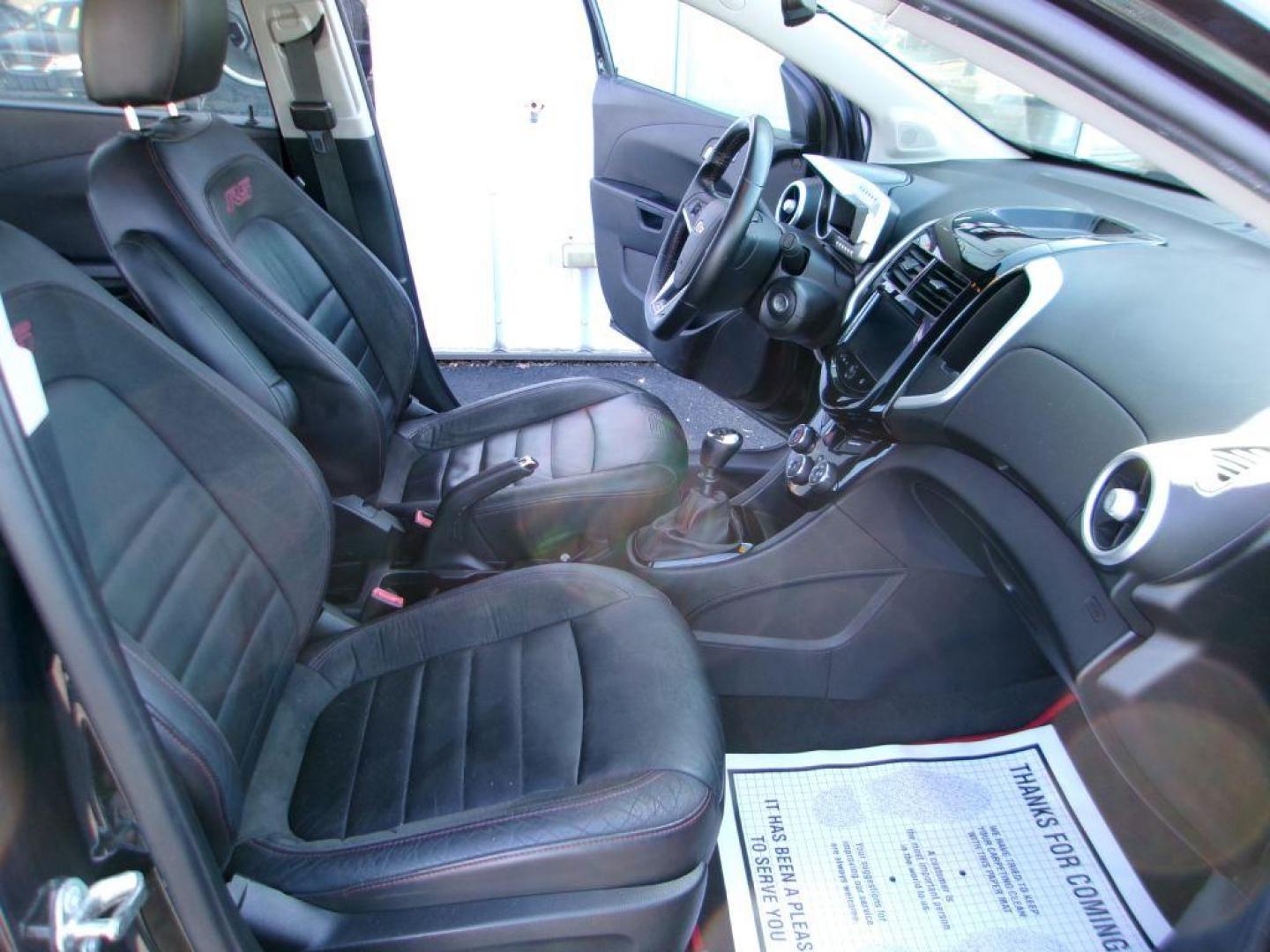 2014 BLACK CHEVROLET SONIC RS (1G1JH6SB3E4) with an 1.4L engine, 5-Speed Manual transmission, located at 501 E. Columbia St., Springfield, OH, 45503, (800) 262-7122, 39.925262, -83.801796 - *** RS *** Leather Seating *** Serviced and Detailed *** Manual Transmission *** NICE *** Jay North Auto has offered hand picked vehicles since 1965! Our customer's enjoy a NO pressure buying experience with a small town feel. All of our vehicles get fully inspected and detailed. We are a prefe - Photo#16