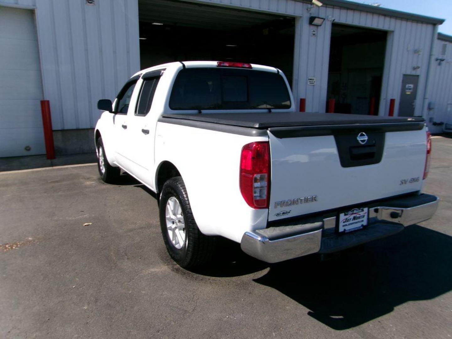 2016 WHITE NISSAN FRONTIER SV (1N6AD0EV7GN) with an 4.0L engine, Automatic transmission, located at 501 E. Columbia St., Springfield, OH, 45503, (800) 262-7122, 39.925262, -83.801796 - *** SV *** New Tires *** 4x4 *** Serviced and Detailed *** 4.0L V6 *** Clean CarFax *** Jay North Auto has offered hand picked vehicles since 1965! Our customer's enjoy a NO pressure buying experience with a small town feel. All of our vehicles get fully inspected and detailed. We are a preferr - Photo#5