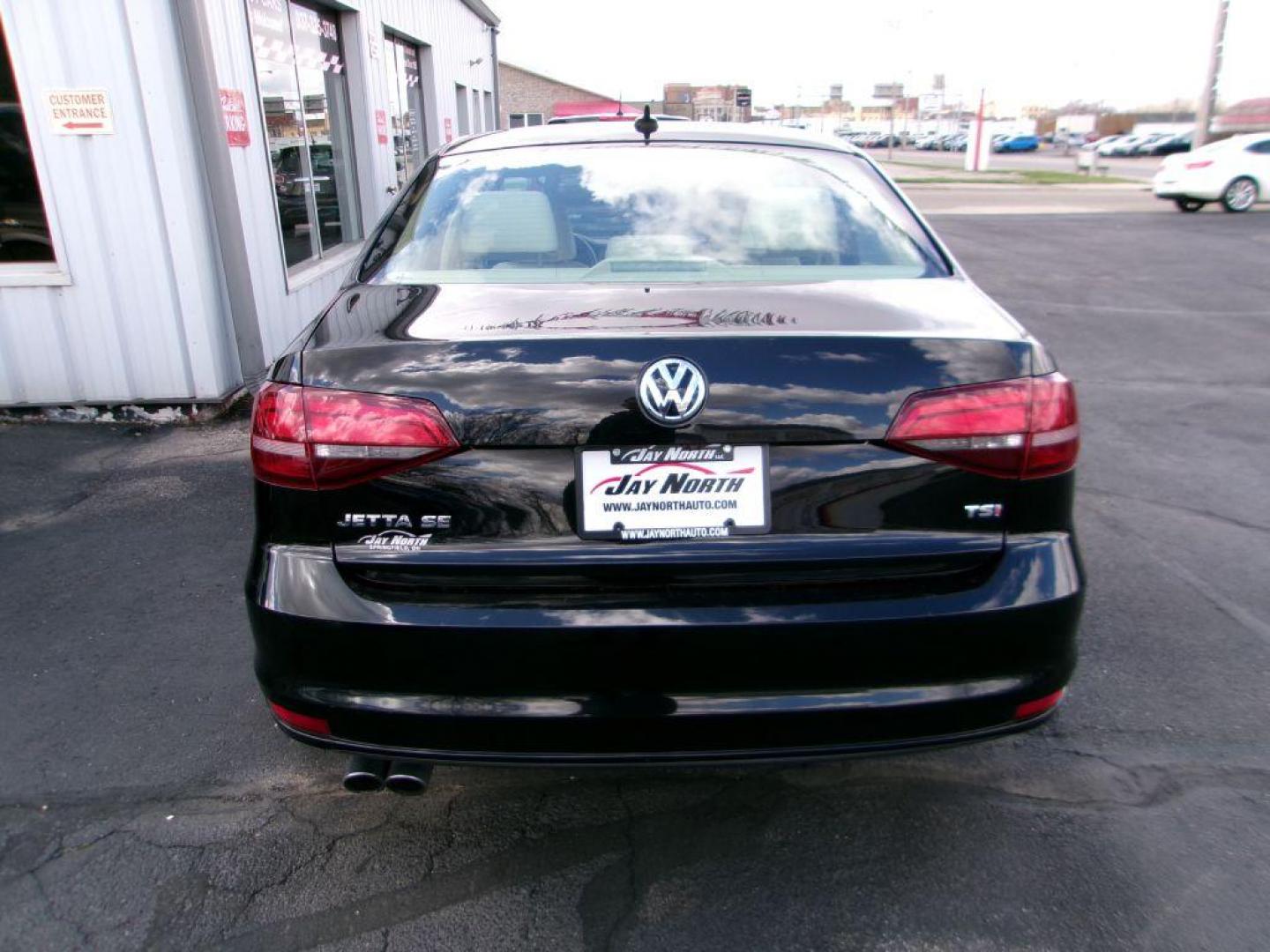 2017 BLACK VOLKSWAGEN JETTA SE (3VWDB7AJ8HM) with an 1.4L engine, Automatic transmission, located at 501 E. Columbia St., Springfield, OH, 45503, (800) 262-7122, 39.925262, -83.801796 - *** New Tires *** Serviced and Detailed *** New Brakes *** SE *** Moonroof *** Leather *** Jay North Auto has offered hand picked vehicles since 1965! Our customer's enjoy a NO pressure buying experience with a small town feel. All of our vehicles get fully inspected and detailed. We are a pref - Photo#4