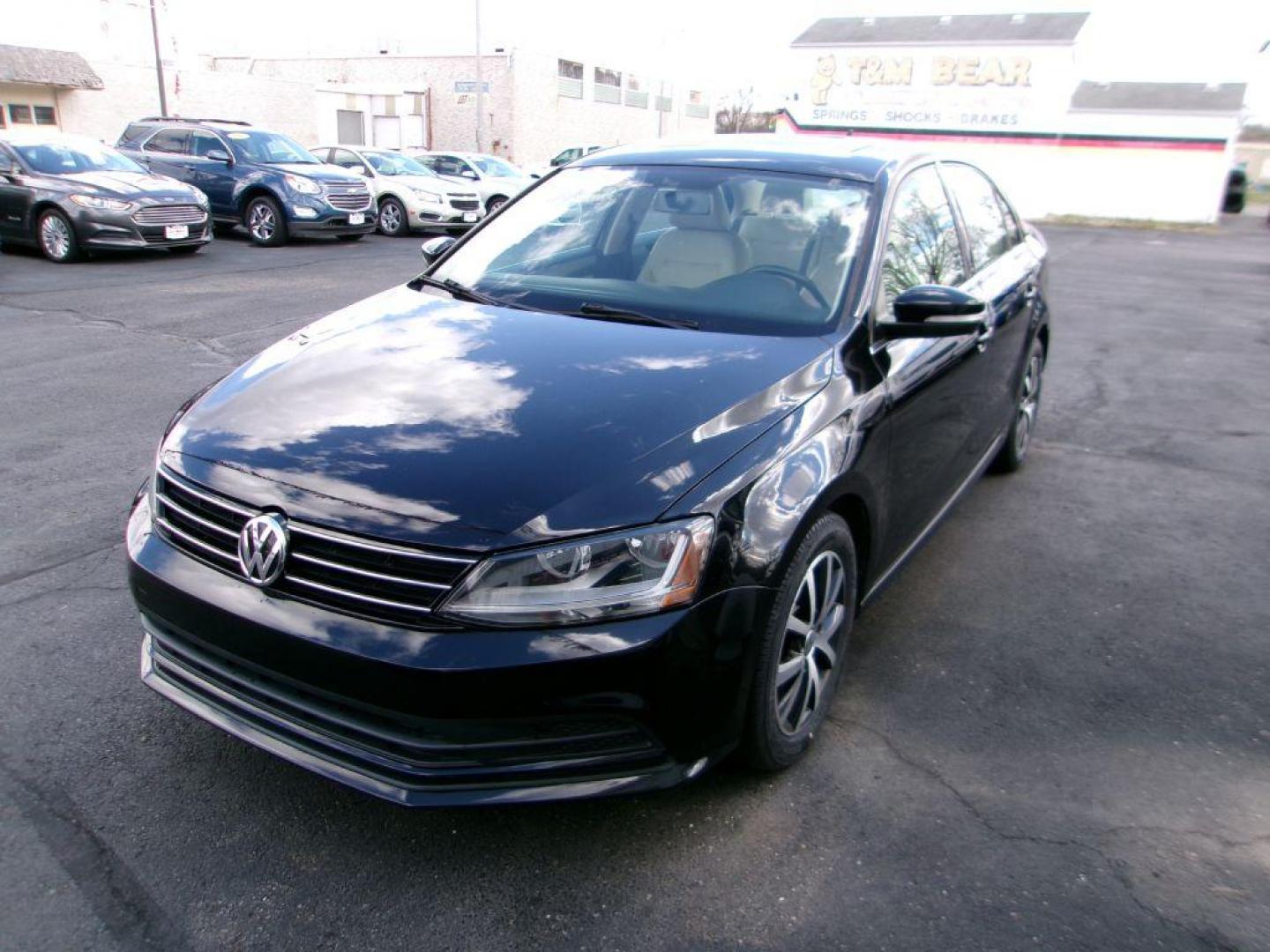 2017 BLACK VOLKSWAGEN JETTA SE (3VWDB7AJ8HM) with an 1.4L engine, Automatic transmission, located at 501 E. Columbia St., Springfield, OH, 45503, (800) 262-7122, 39.925262, -83.801796 - *** New Tires *** Serviced and Detailed *** New Brakes *** SE *** Moonroof *** Leather *** Jay North Auto has offered hand picked vehicles since 1965! Our customer's enjoy a NO pressure buying experience with a small town feel. All of our vehicles get fully inspected and detailed. We are a pref - Photo#6