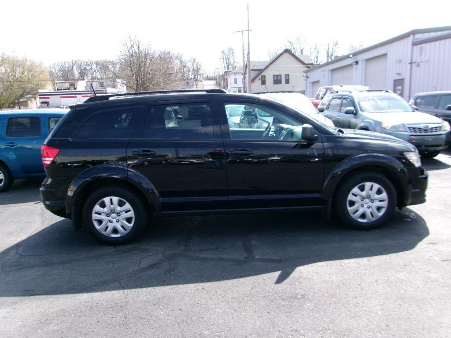 2019 BLACK DODGE JOURNEY SE (3C4PDCAB9KT) with an 2.4L engine, Automatic transmission, located at 501 E. Columbia St., Springfield, OH, 45503, (800) 262-7122, 39.925262, -83.801796 - Photo#0