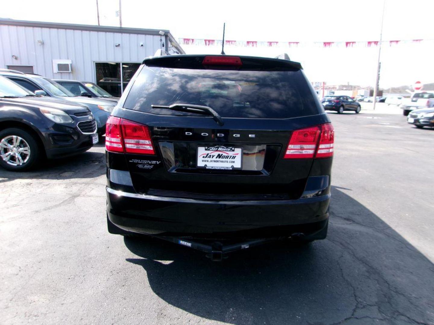 2019 BLACK DODGE JOURNEY SE (3C4PDCAB9KT) with an 2.4L engine, Automatic transmission, located at 501 E. Columbia St., Springfield, OH, 45503, (800) 262-7122, 39.925262, -83.801796 - Photo#4