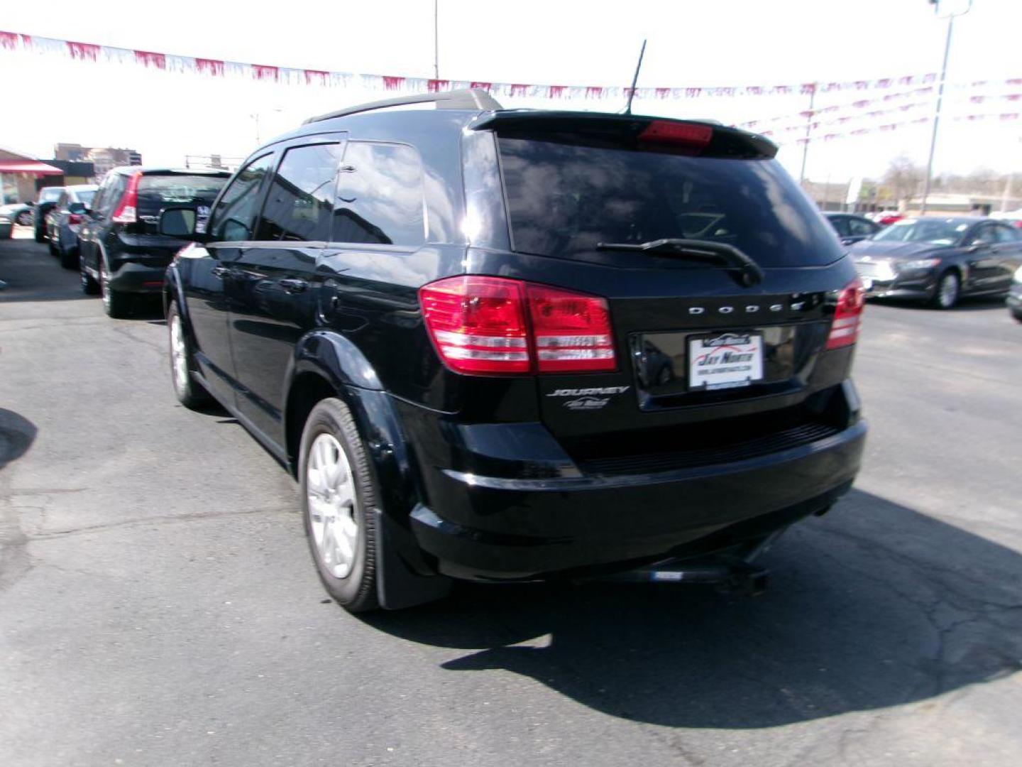 2019 BLACK DODGE JOURNEY SE (3C4PDCAB9KT) with an 2.4L engine, Automatic transmission, located at 501 E. Columbia St., Springfield, OH, 45503, (800) 262-7122, 39.925262, -83.801796 - Photo#5