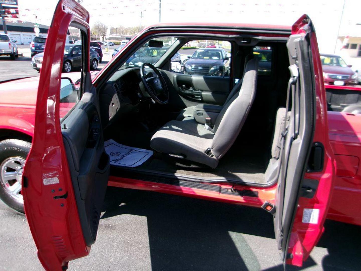 2001 RED FORD RANGER SUPER CAB (1FTYR14U71T) with an 3.0L engine, Automatic transmission, located at 501 E. Columbia St., Springfield, OH, 45503, (800) 262-7122, 39.925262, -83.801796 - *** Local Trade in *** Serviced and Detailed *** Power Windows and Locks *** Bedliner *** Sliding Rear Window *** 4 Door *** 3.0L V6 *** Jay North Auto has offered hand picked vehicles since 1965! Our customer's enjoy a NO pressure buying experience with a small town feel. All of our vehicles g - Photo#9