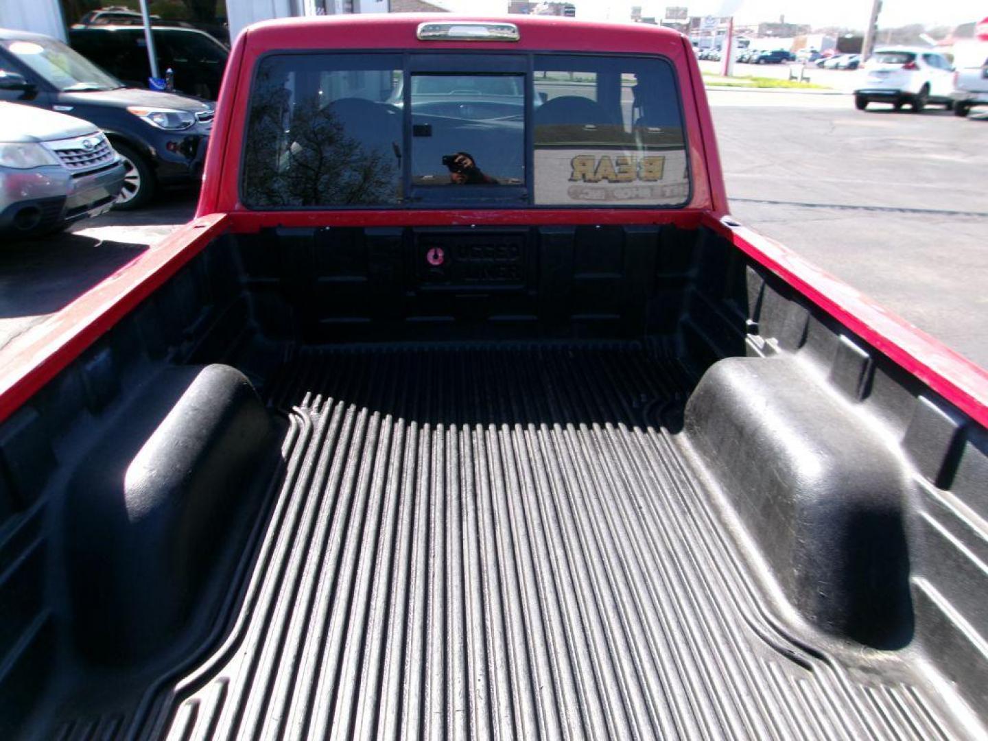 2001 RED FORD RANGER SUPER CAB (1FTYR14U71T) with an 3.0L engine, Automatic transmission, located at 501 E. Columbia St., Springfield, OH, 45503, (800) 262-7122, 39.925262, -83.801796 - *** Local Trade in *** Serviced and Detailed *** Power Windows and Locks *** Bedliner *** Sliding Rear Window *** 4 Door *** 3.0L V6 *** Jay North Auto has offered hand picked vehicles since 1965! Our customer's enjoy a NO pressure buying experience with a small town feel. All of our vehicles g - Photo#7