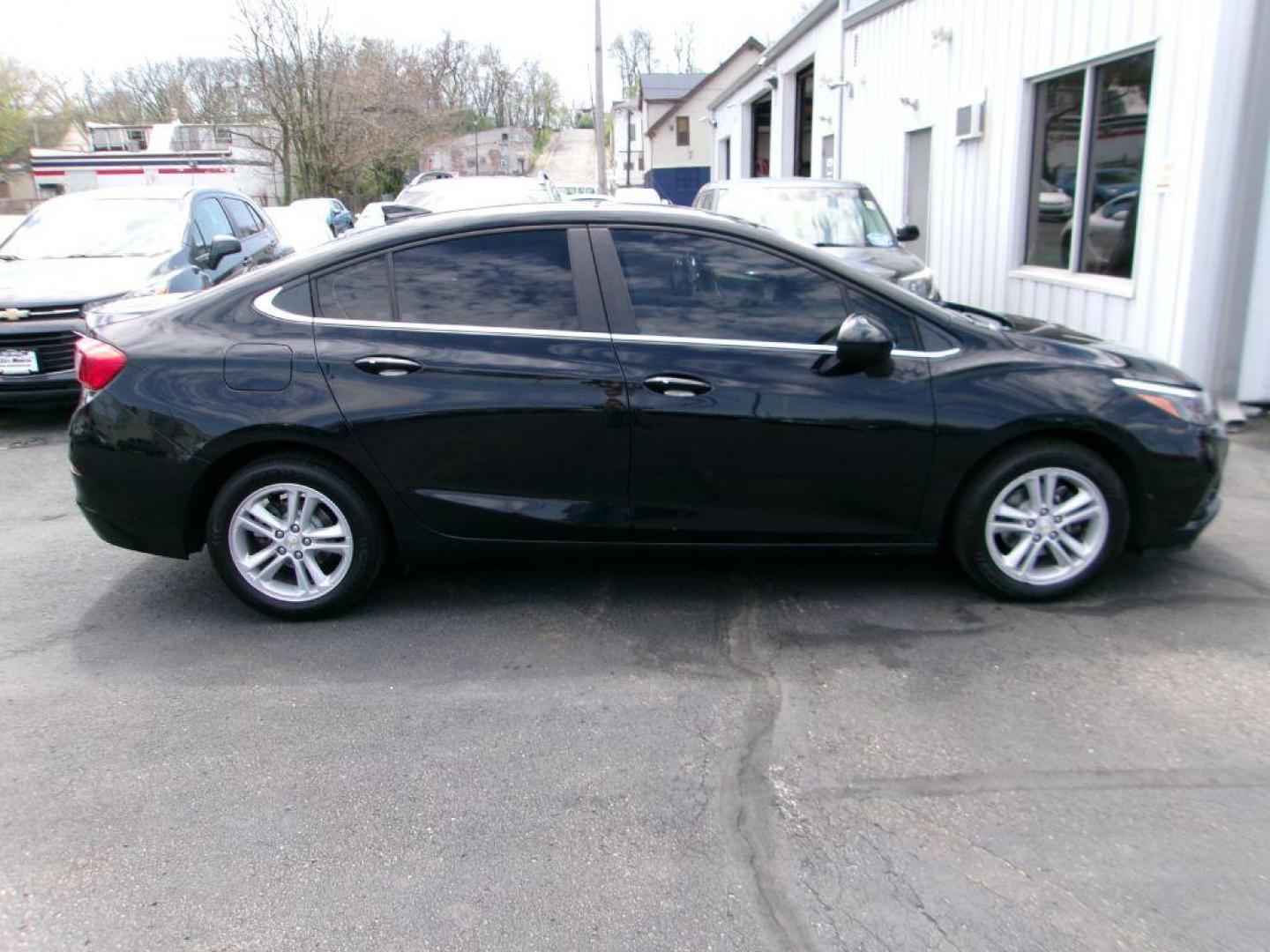 2018 BLACK CHEVROLET CRUZE LT (1G1BE5SM3J7) with an 1.4L engine, Automatic transmission, located at 501 E. Columbia St., Springfield, OH, 45503, (800) 262-7122, 39.925262, -83.801796 - ***Clean Carfax***LT***New Front and Rear Brake Pads and Rotors***Moonroof***Serviced and Detailed*** Jay North Auto has offered hand picked vehicles since 1965! Our customer's enjoy a NO pressure buying experience with a small town feel. All of our vehicles get fully inspected and detailed. W - Photo#0