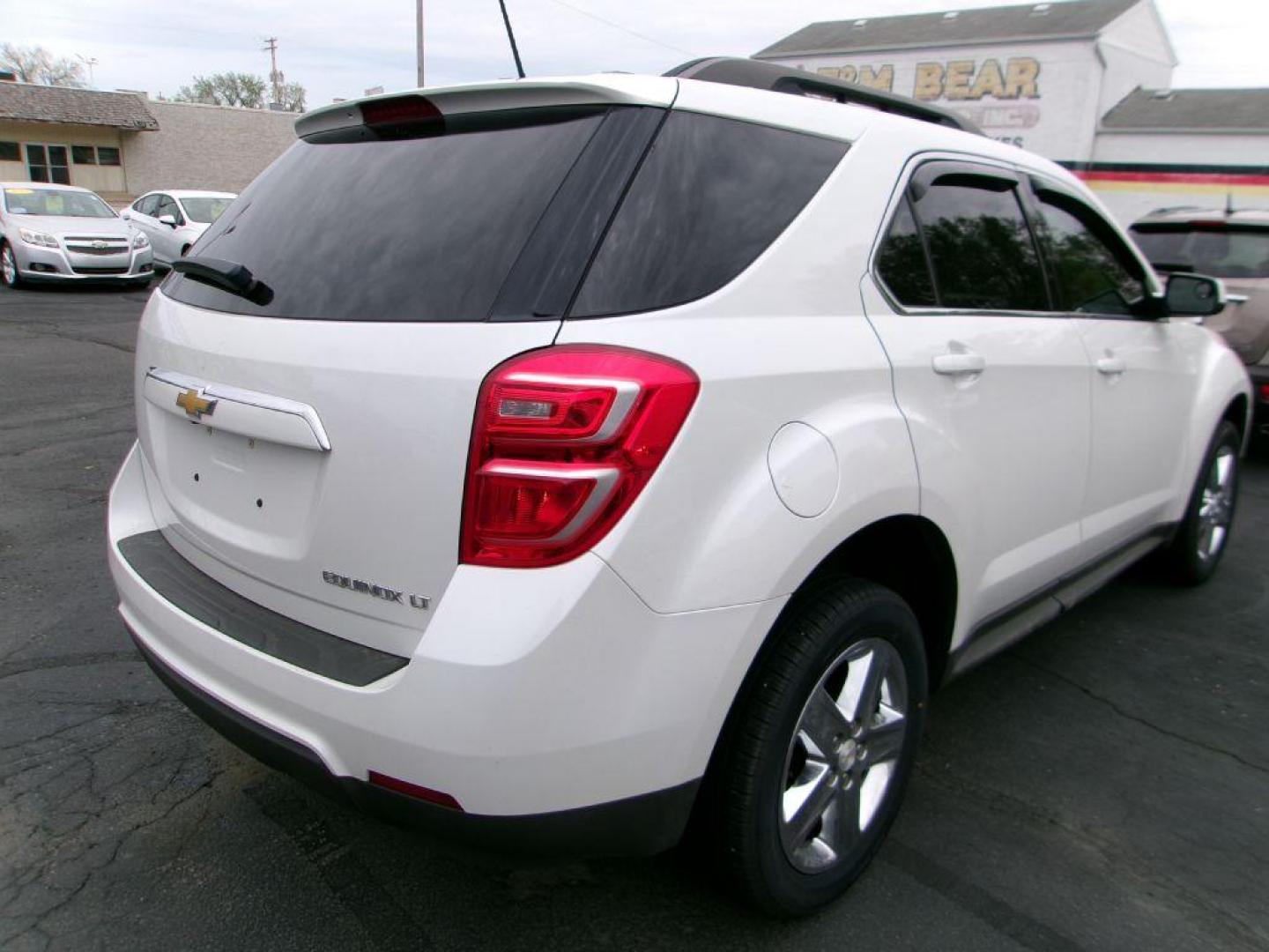 2016 WHITE CHEVROLET EQUINOX LT (2GNALCEKXG6) with an 2.4L engine, Automatic transmission, located at 501 E. Columbia St., Springfield, OH, 45503, (800) 262-7122, 39.925262, -83.801796 - *** Clean CarFax *** Serviced and Detailed *** FWD *** LT *** Remote Start *** Moonroof *** NICE *** Jay North Auto has offered hand picked vehicles since 1965! Our customer's enjoy a NO pressure buying experience with a small town feel. All of our vehicles get fully inspected and detailed. We - Photo#3