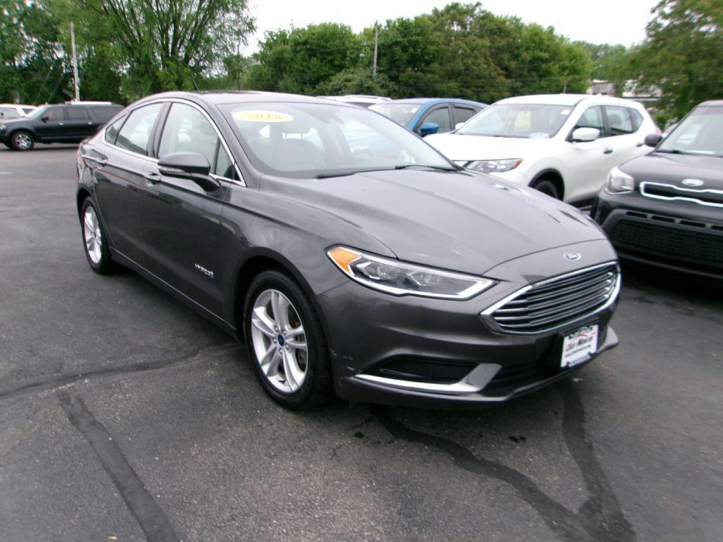 2018 GRAY FORD FUSION SE HYBRID (3FA6P0LU5JR) with an 2.0L engine, Continuously Variable transmission, located at 501 E. Columbia St., Springfield, OH, 45503, (800) 262-7122, 39.925262, -83.801796 - *** Leather *** Back Up Camera *** SE Hybrid *** Serviced and Detailed *** Clean CarFax with 21 Service Records *** Alloy Wheels *** Jay North Auto has offered hand picked vehicles since 1965! Our customer's enjoy a NO pressure buying experience with a small town feel. All of our vehicles get f - Photo#3