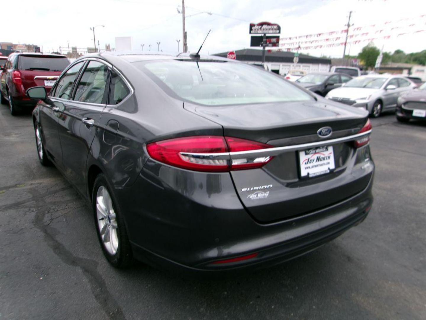 2018 GRAY FORD FUSION SE HYBRID (3FA6P0LU5JR) with an 2.0L engine, Continuously Variable transmission, located at 501 E. Columbia St., Springfield, OH, 45503, (800) 262-7122, 39.925262, -83.801796 - *** Leather *** Back Up Camera *** SE Hybrid *** Serviced and Detailed *** Clean CarFax with 21 Service Records *** Alloy Wheels *** Jay North Auto has offered hand picked vehicles since 1965! Our customer's enjoy a NO pressure buying experience with a small town feel. All of our vehicles get f - Photo#6
