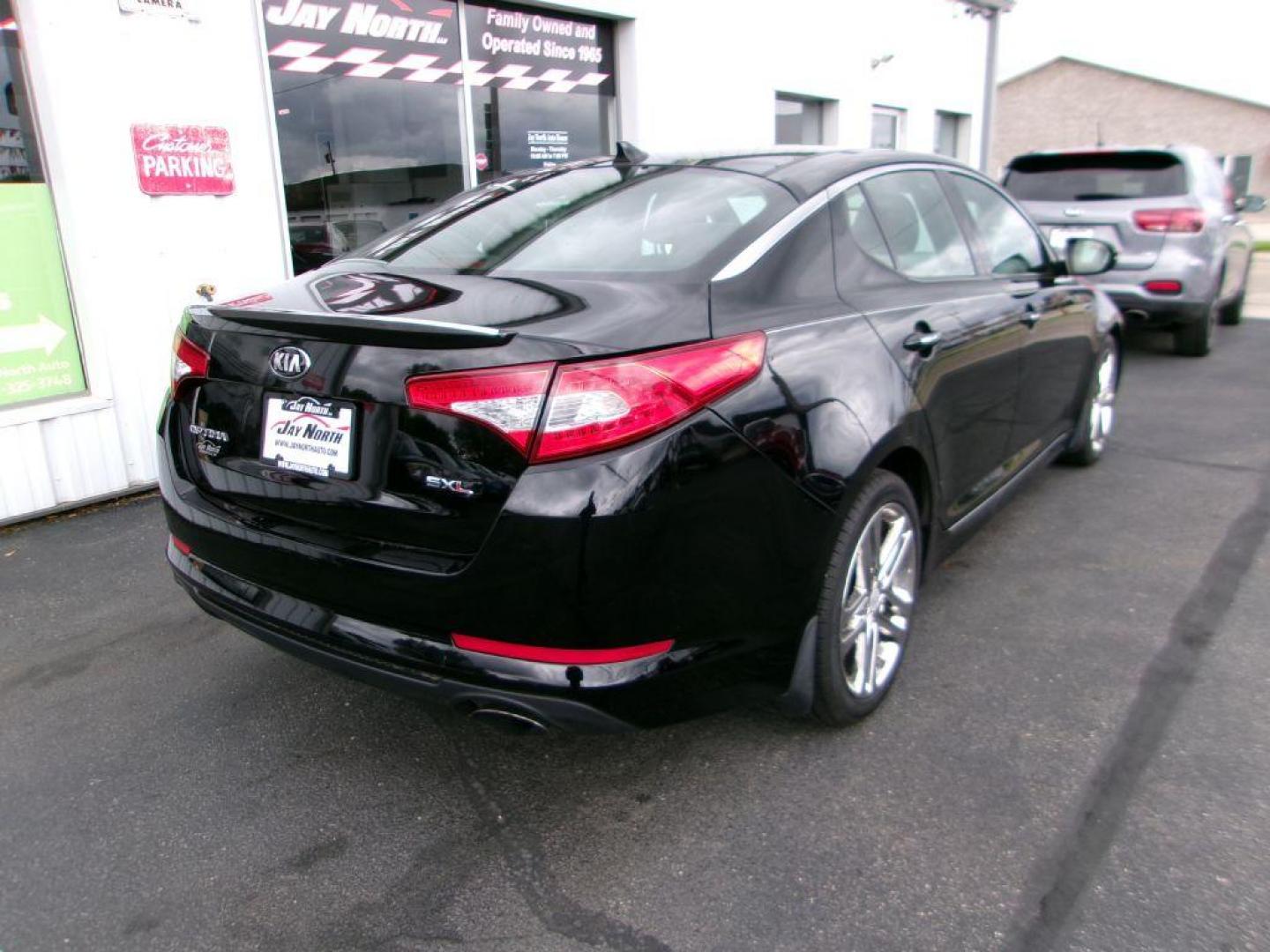 2013 BLACK KIA OPTIMA SXL (5XXGR4A6XDG) , Automatic transmission, located at 501 E. Columbia St., Springfield, OH, 45503, (800) 262-7122, 39.925262, -83.801796 - *** Local Trade *** Serviced and Detailed *** Loaded *** SX Premium Touring Package- Panoramic Sunroof- Power Folding Outside Mirrors- Infinity Audio System- UVO Powered by Microsoft- HD Radio Technology- Rear Camera Display- Power Front Passenger's Seat- Driver's Seat Memory- Heated and Cooled Fron - Photo#3