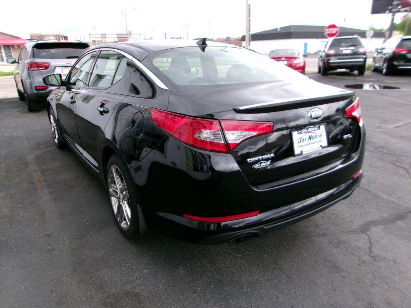 2013 BLACK KIA OPTIMA SXL (5XXGR4A6XDG) , Automatic transmission, located at 501 E. Columbia St., Springfield, OH, 45503, (800) 262-7122, 39.925262, -83.801796 - *** Local Trade *** Serviced and Detailed *** Loaded *** SX Premium Touring Package- Panoramic Sunroof- Power Folding Outside Mirrors- Infinity Audio System- UVO Powered by Microsoft- HD Radio Technology- Rear Camera Display- Power Front Passenger's Seat- Driver's Seat Memory- Heated and Cooled Fron - Photo#5